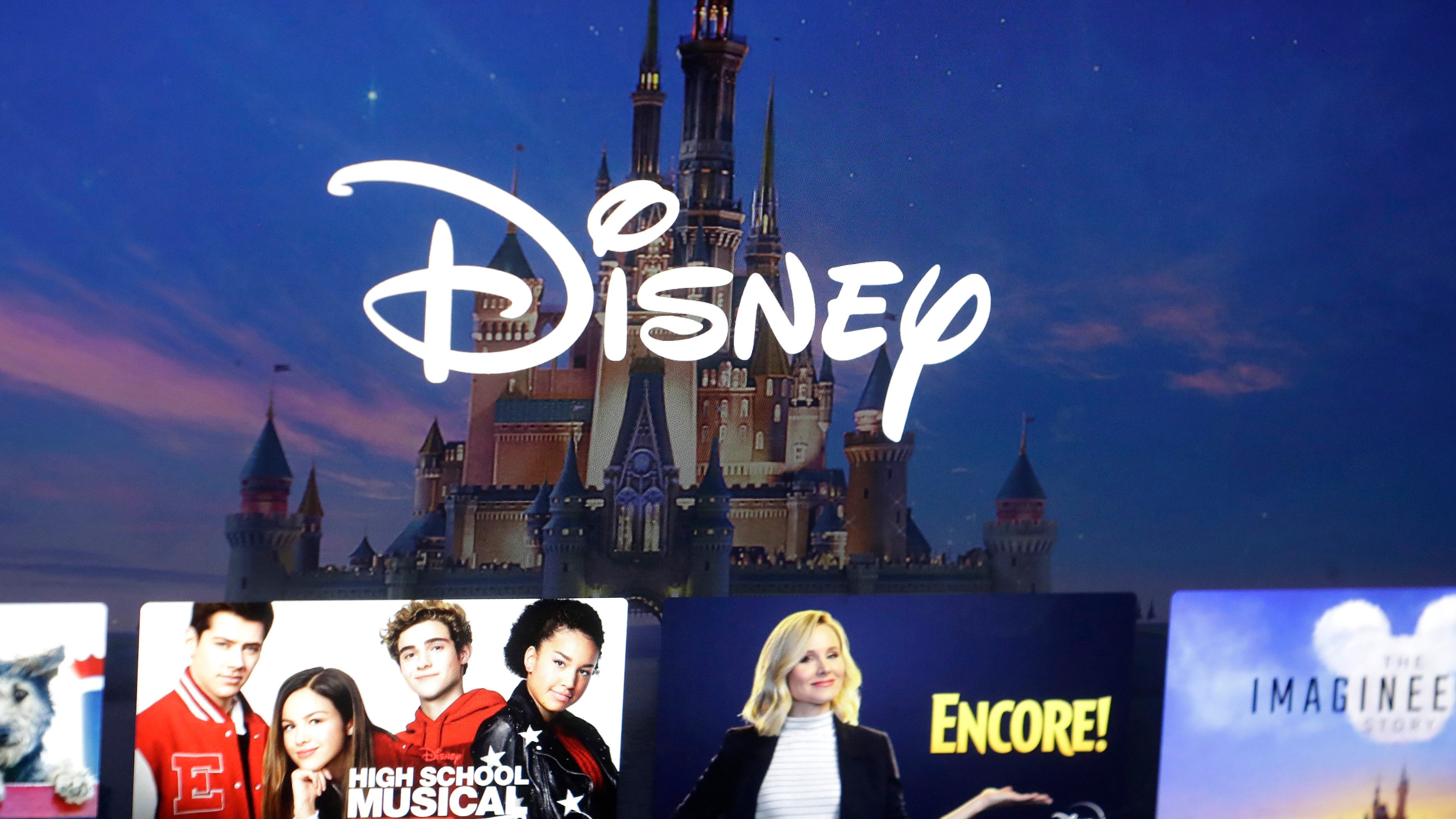 FILE - In this Nov. 13, 2019 file photo, a Disney logo forms part of a menu for the Disney Plus movie and entertainment streaming service on a computer screen in Walpole, Mass. (AP Photo/Steven Senne, File)