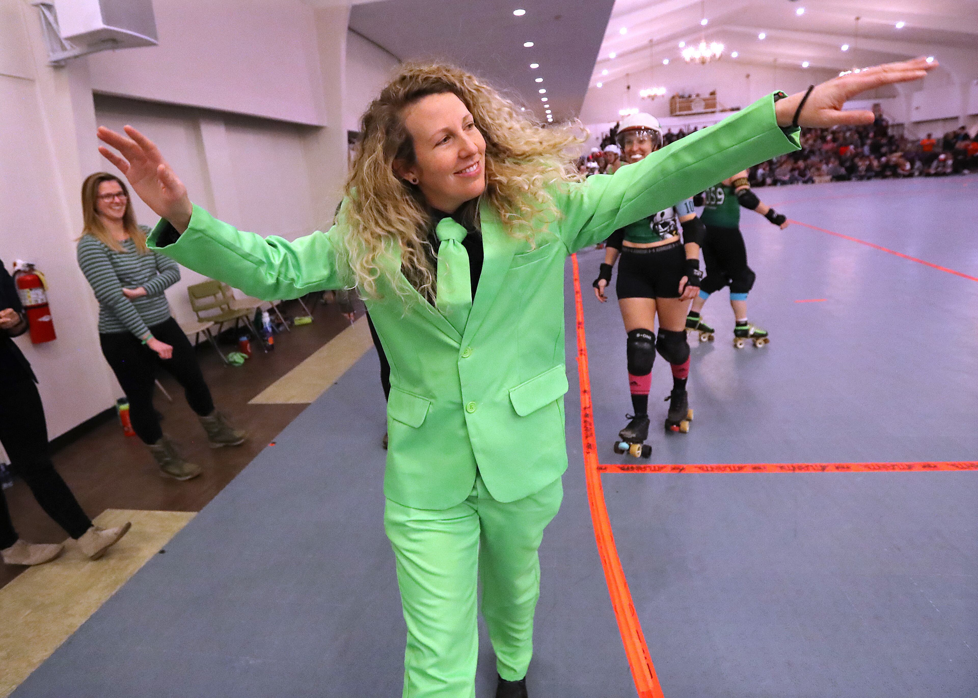 January 25, 2020 Atlanta: Toxi Shocks jammer coach Kate Robinson sports the team green to inspire her players and fans during their pre-pandemic Atlanta Roller Derby game at the Yaarab Shrine Center on Saturday, January 25, 2020, in Atlanta. Curtis Compton ccompton@ajc.com