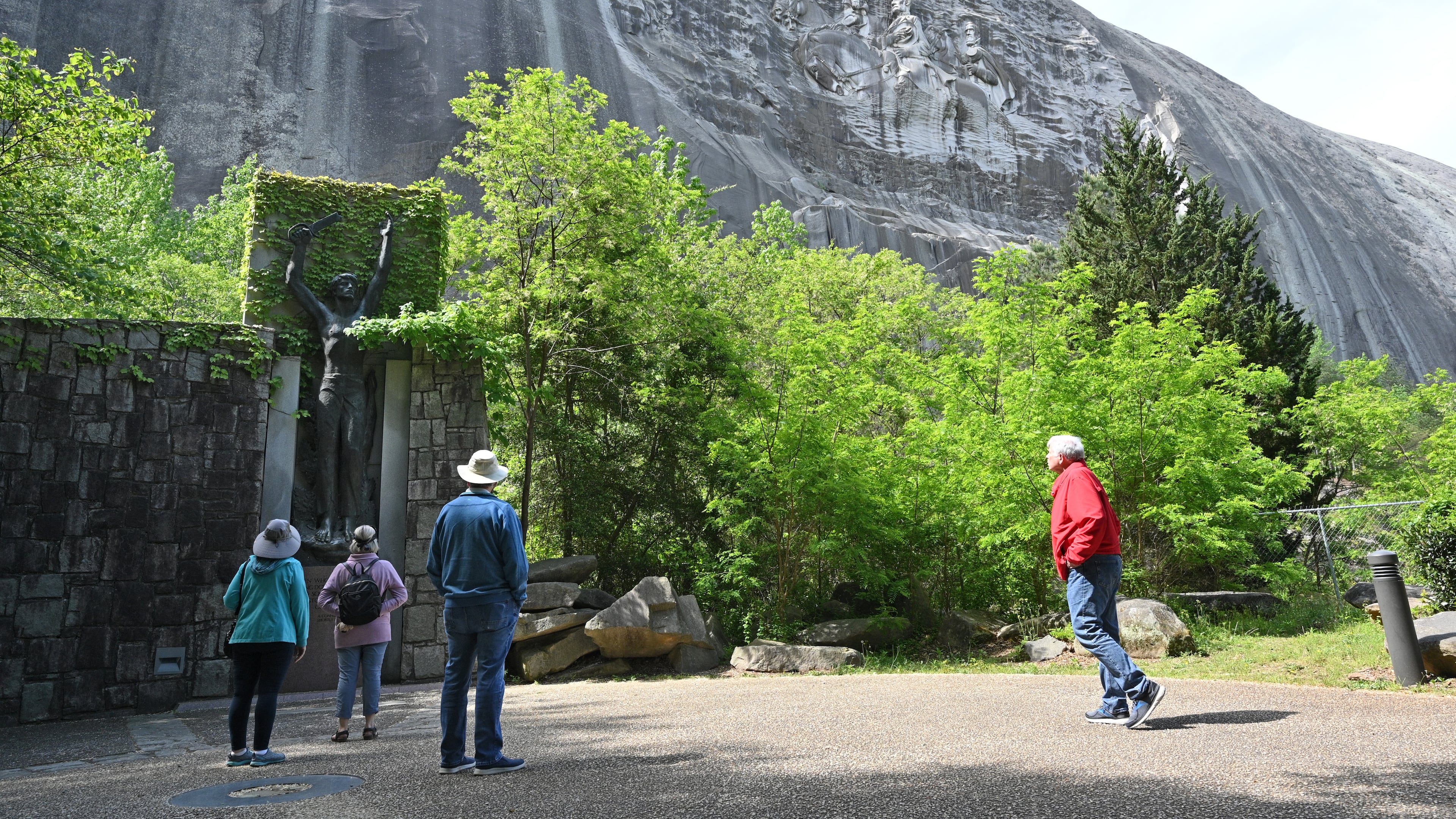April 20, 2021 Stone Mountain - Park goers walk around Valor Park were Statue of Valor is located at Stone Mountain Park on Tuesday, April 20, 2021. (Hyosub Shin / Hyosub.Shin@ajc.com)