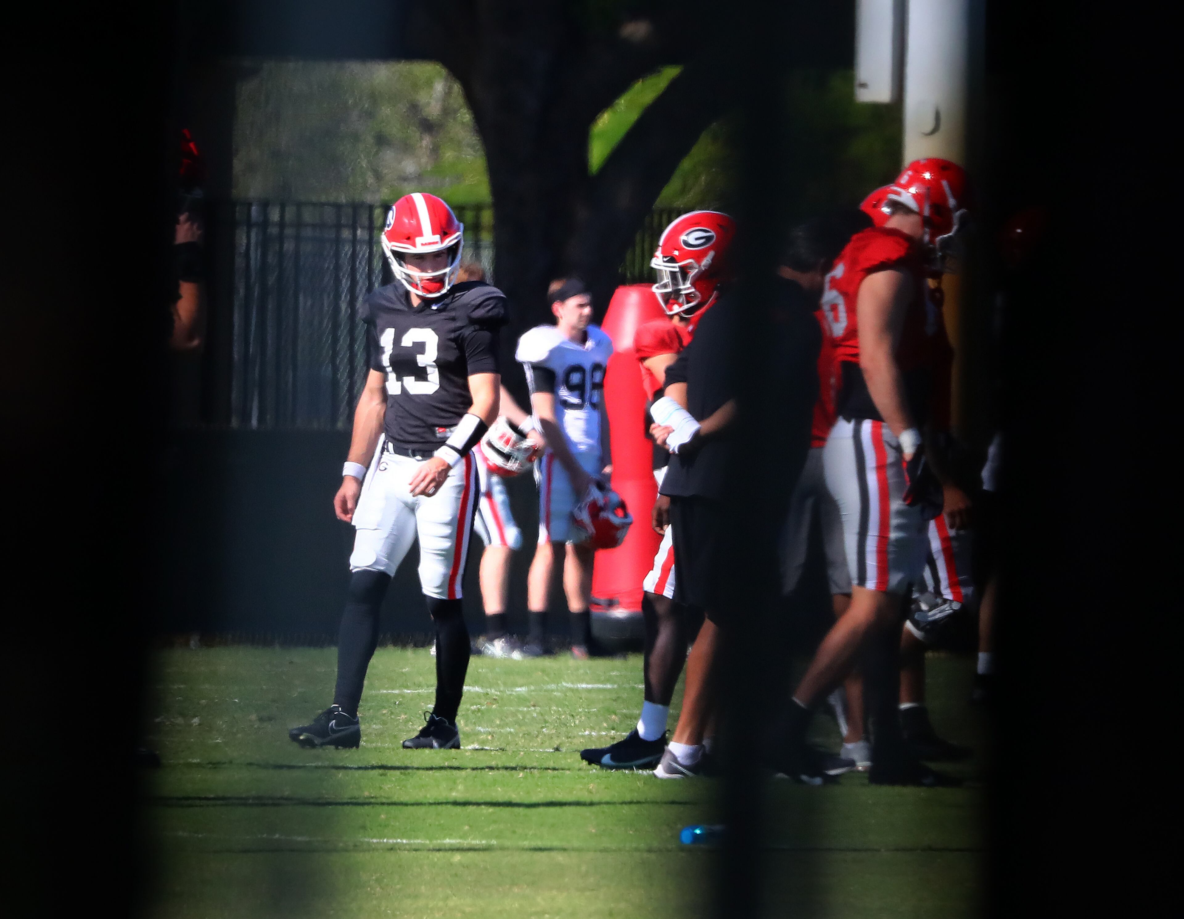 122721 Miami Shores: Georgia quarterback Stetson Bennett (left) and teammates get in some practice for the Orange Bowl at Barry University on Monday, Dec 27, 2021, in Miami Shores. Georgia plays Michigan at 7:30 p.m. on Friday at Hard Rock Stadium in Miami Gardens, Fla., in the Orange Bowl CFP Semifinal. “Curtis Compton / Curtis.Compton@ajc.com”`