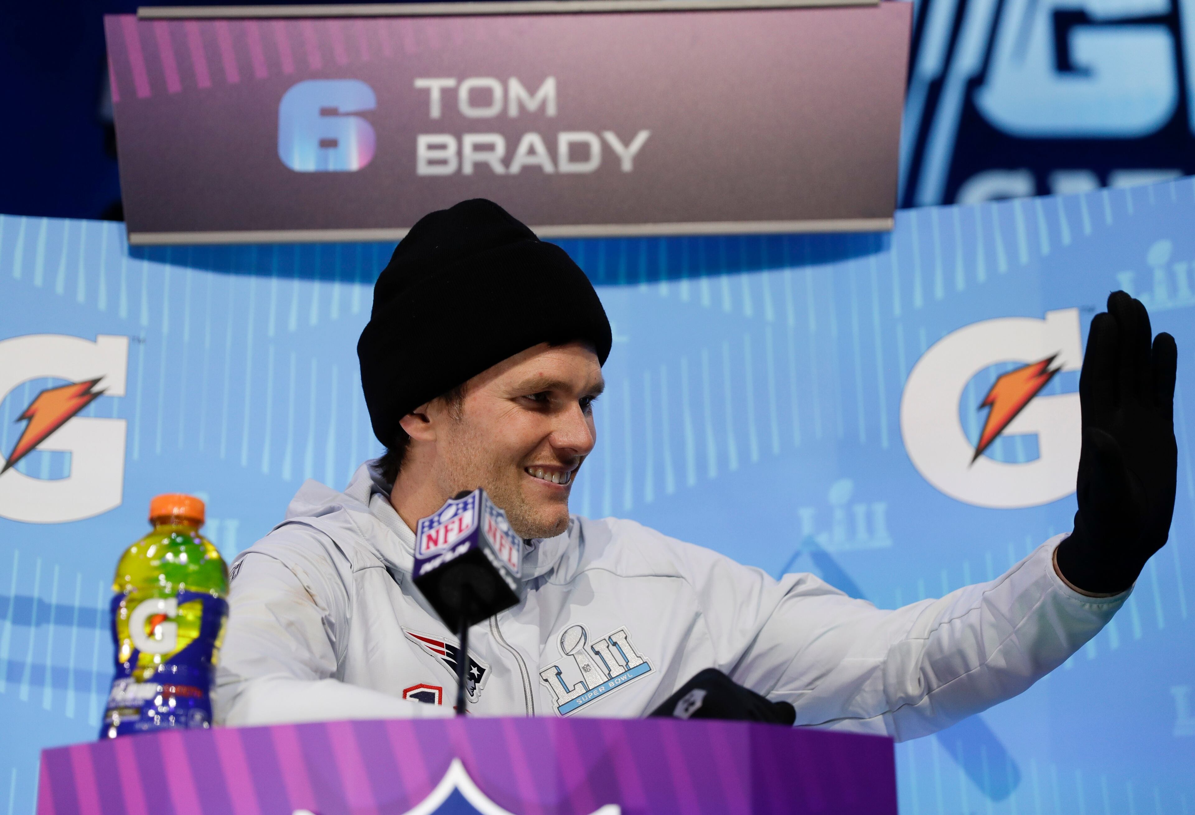 New England Patriots' Tom Brady waves during NFL football Super Bowl 52 Opening Night Monday, Jan. 29, 2018, at the Xcel Center in St. Paul, Minn. (AP Photo/Matt Slocum)