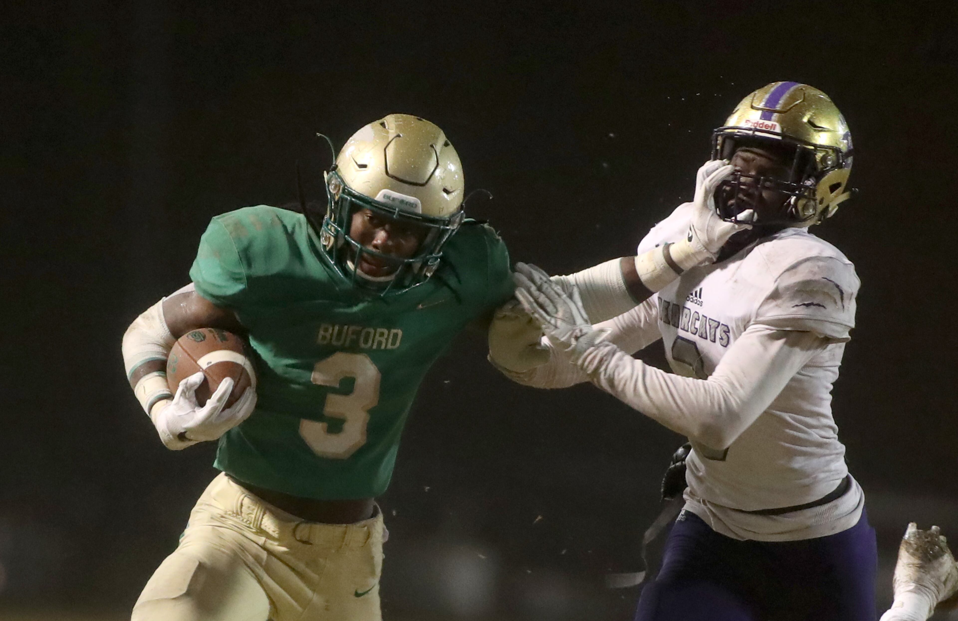 November 23, 2018 - Buford, Ga: Buford running back Derrian Brown (3) runs against Bainbridge defensive back Deyon Bouie (3) in the second half at Buford High School Friday, November 23, 2018, in Buford, Ga. Buford lost to Bainbridge 23-20. This is the quarter finals of the Class 5A state playoffs. (JASON GETZ/SPECIAL TO THE AJC)