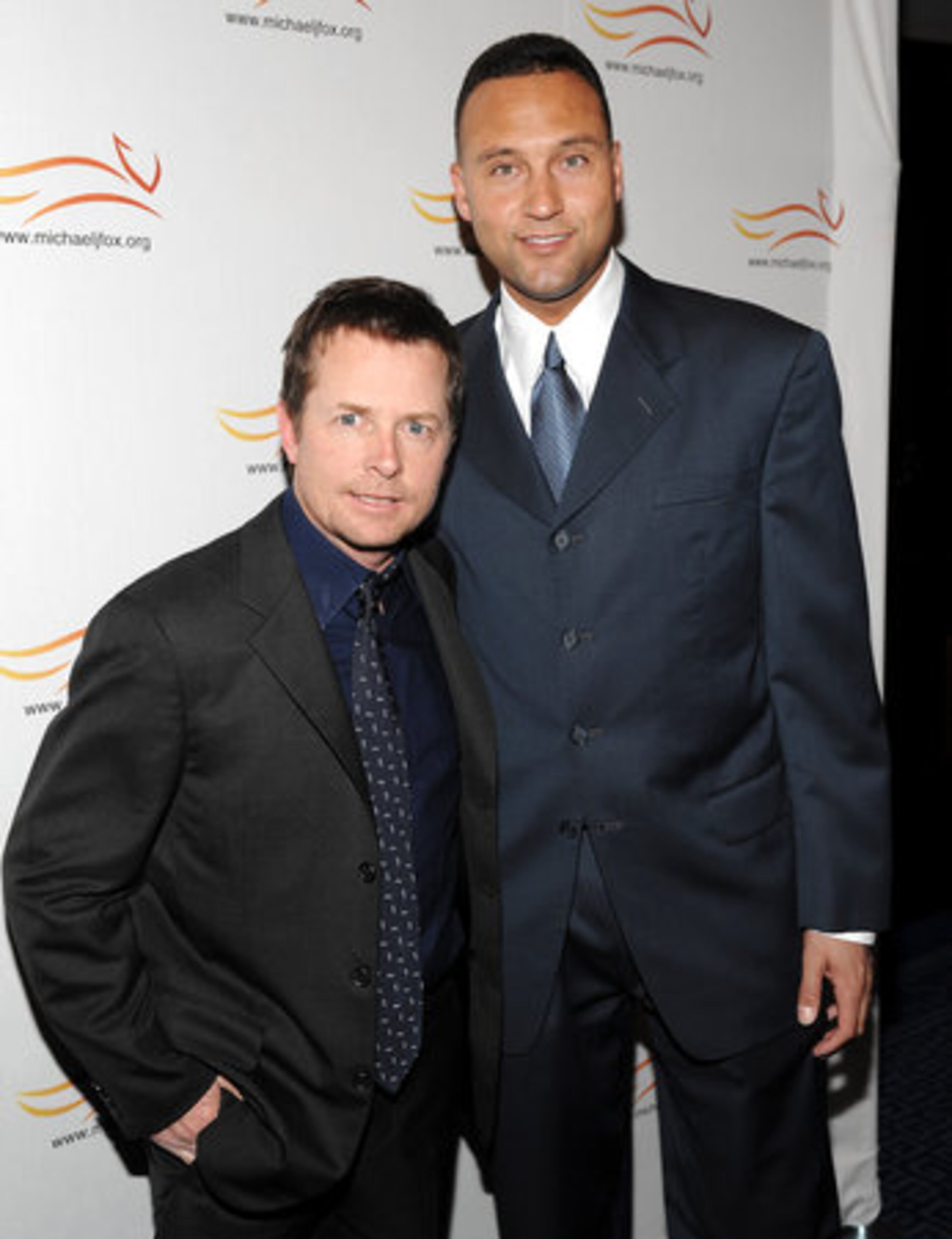 Actor Michael J. Fox, left, and American Major League Baseball player Derek Jeter.