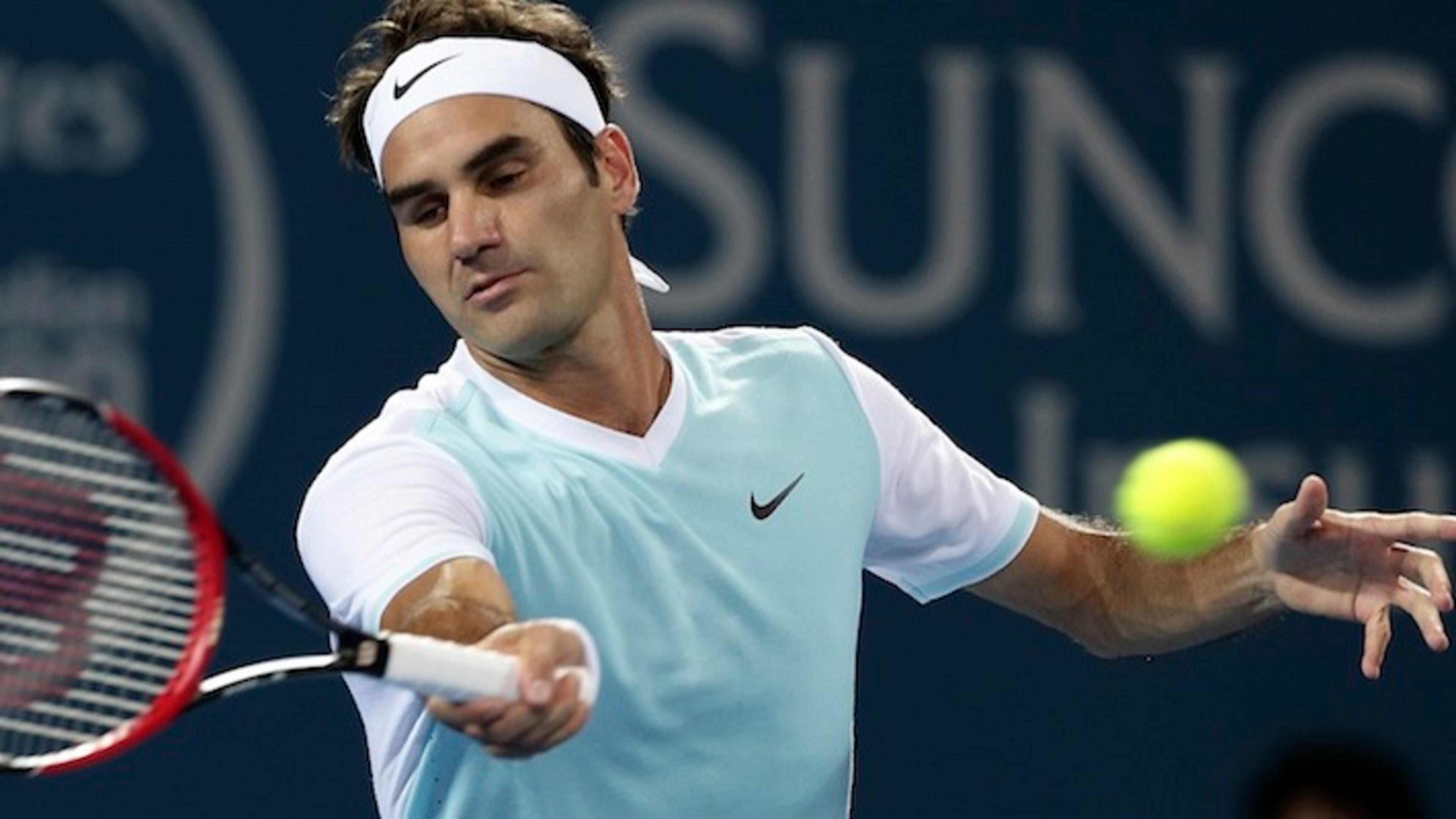 Roger Federer of Switzerland plays a shot in the men's final game against Milos Raonic of Canada during the Brisbane International tennis tournament in Brisbane, Australia, Sunday, Jan. 10, 2016. (AP Photo/Tertius Pickard)