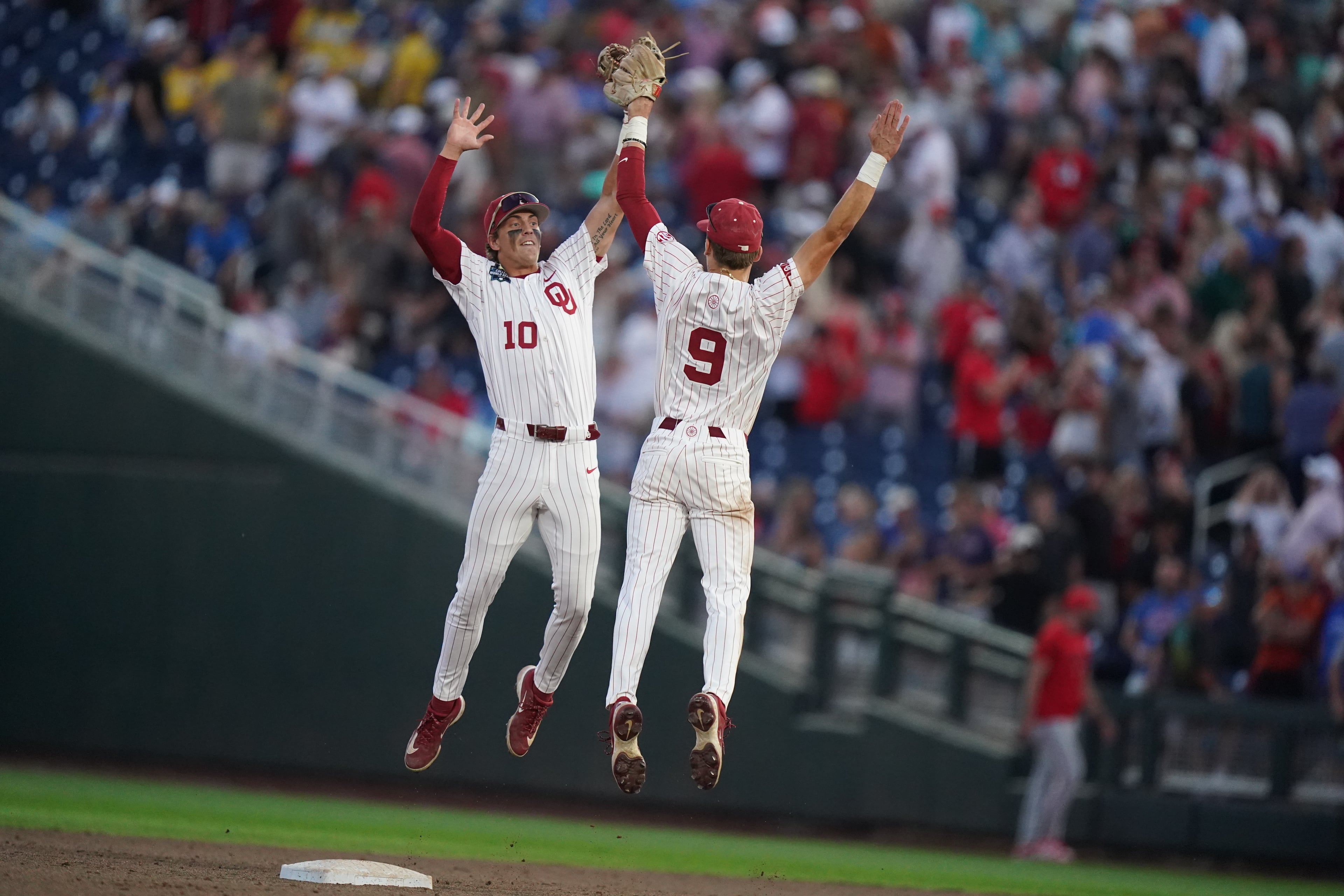 Oklahoma catcher Brendan Brock (left) celebrates with infielder Camden Johnson after defeating Georgia, 4-3, in their College World Series game on Monday, June 15, 2026, in Omaha, Neb. (Vera Nieuwenhuis/AP)