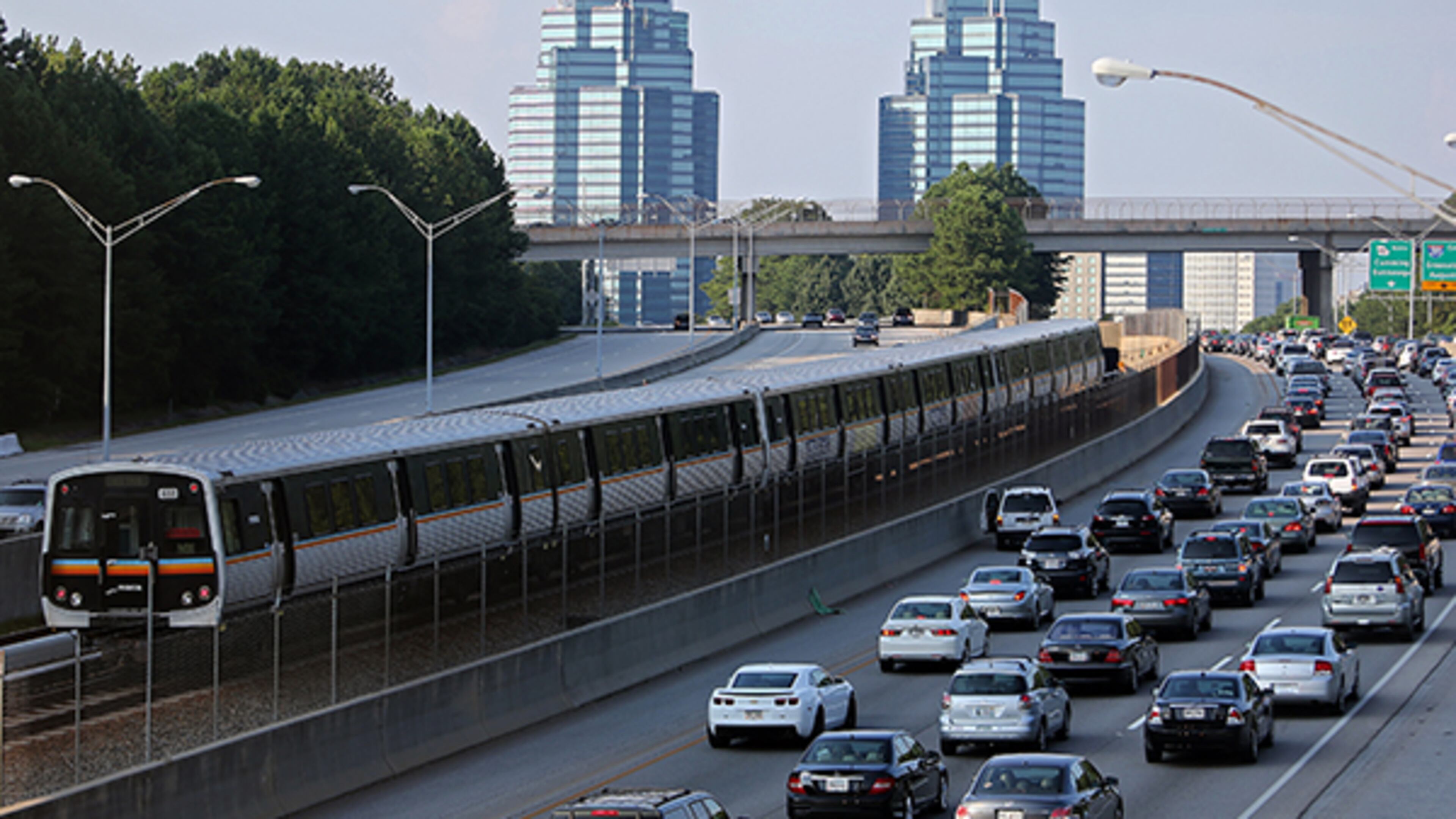 A MARTA train makes its way north on Ga. 400 in Sandy Springs. North Fulton County cities plan public meetings in the coming weeks to inform residents about efforts to update the region’s transportation plan. BEN GRAY / BGRAY@AJC.COM