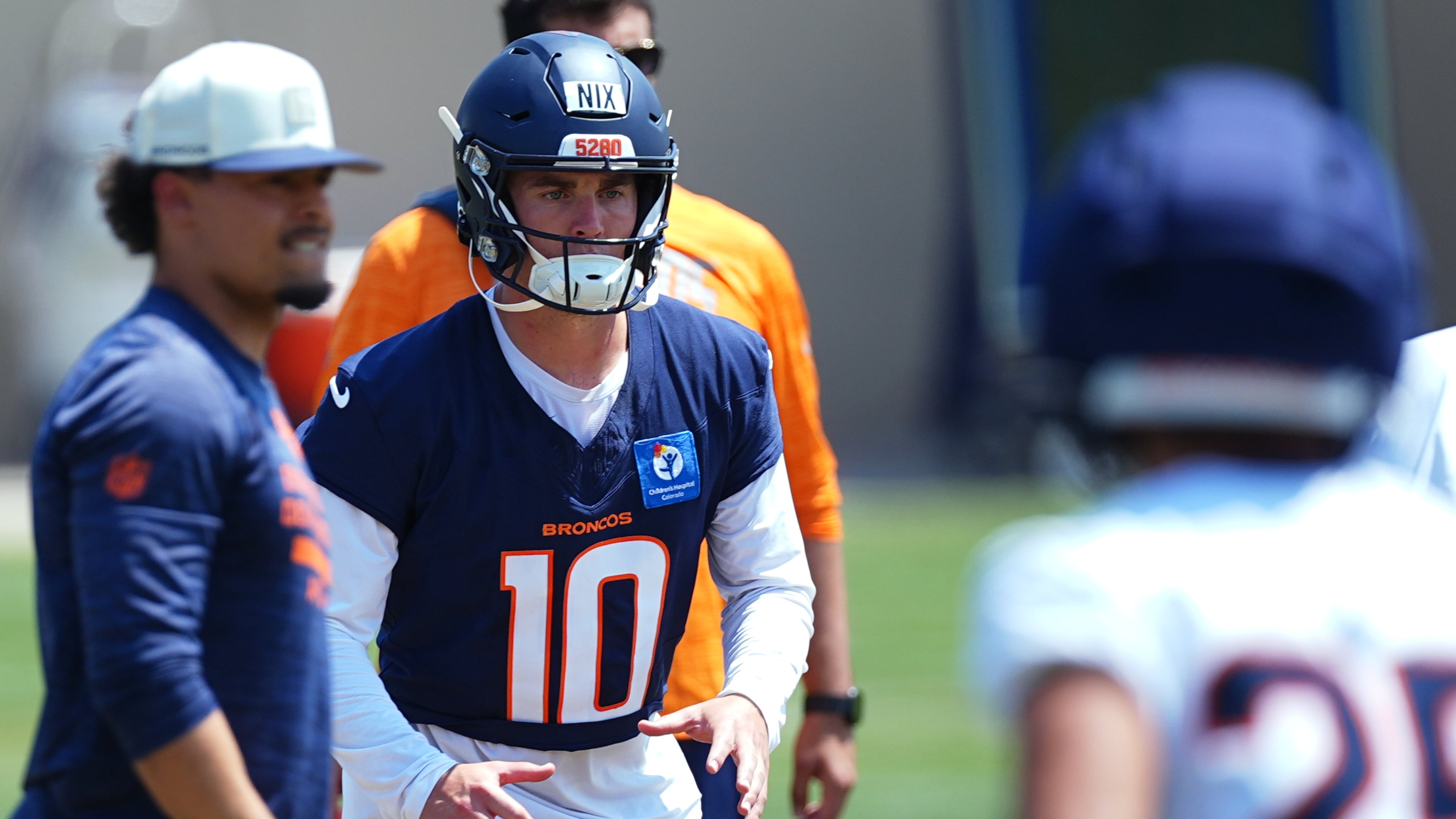 Denver Broncos quarterback Bo Nix takes part in drills at the team's NFL football training camp Wednesday, Aug. 12, 2026, in Centennial, Colo. (AP Photo/David Zalubowski)