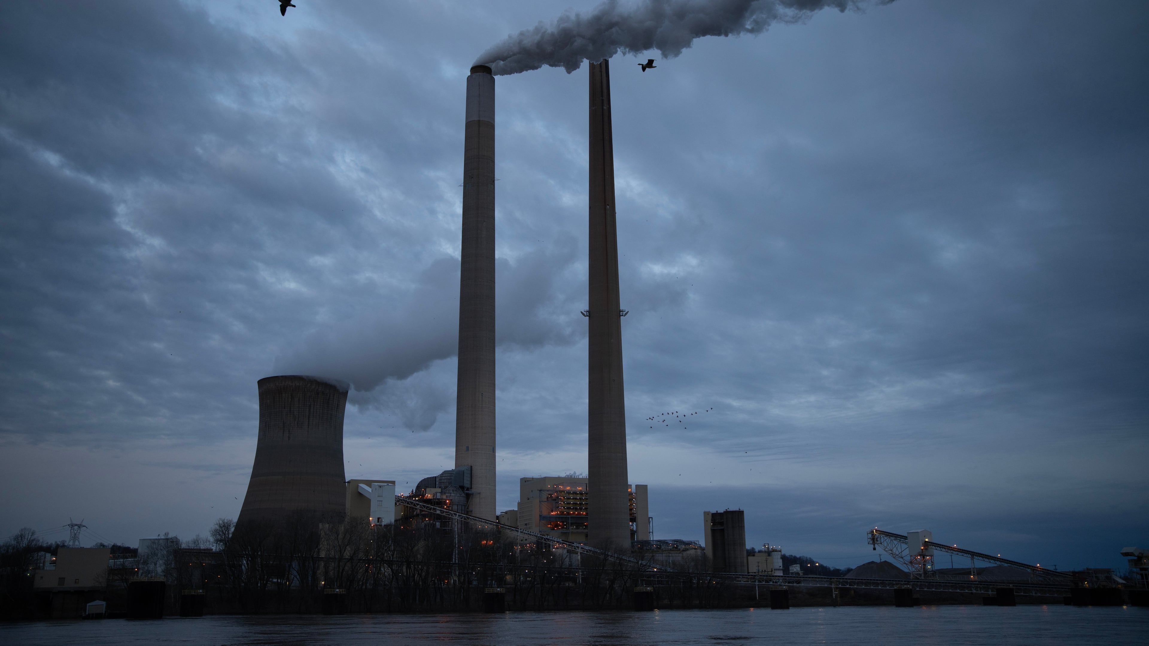 FILE - The coal-fired Mountaineer Power Plant, near New Haven, W.Va., operates across the Ohio River from the Lock 24 RV Park and Campground in Racine, Ohio, March 13, 2026. (AP Photo/Carolyn Kaster, File)
