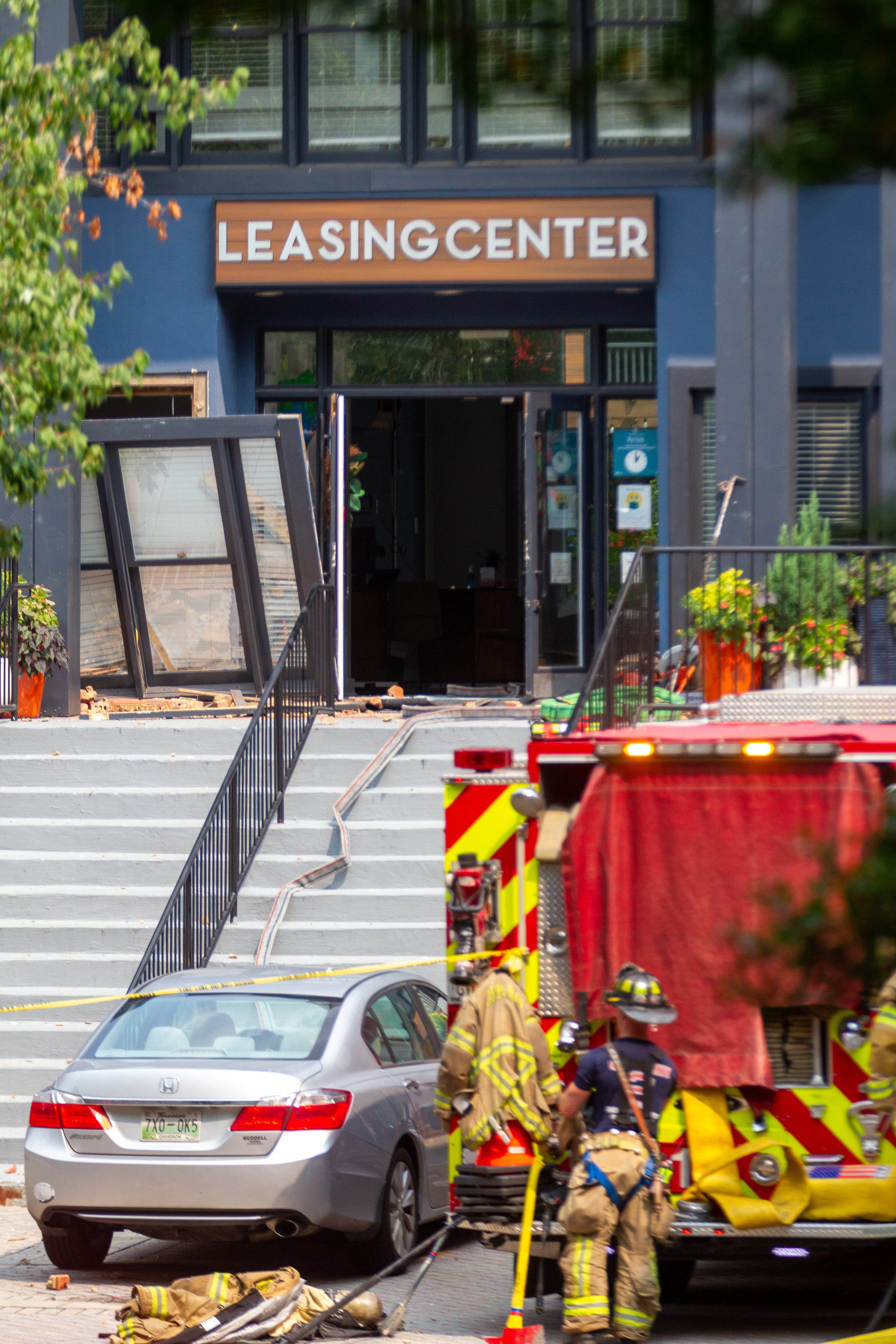DeKalb County firefighters work the scene at the Arrive Perimeter apartment complex after an explosion damaged the building Sunday, September 12, 2021, in Dunwoody. STEVE SCHAEFER FOR THE ATLANTA JOURNAL-CONSTITUTION