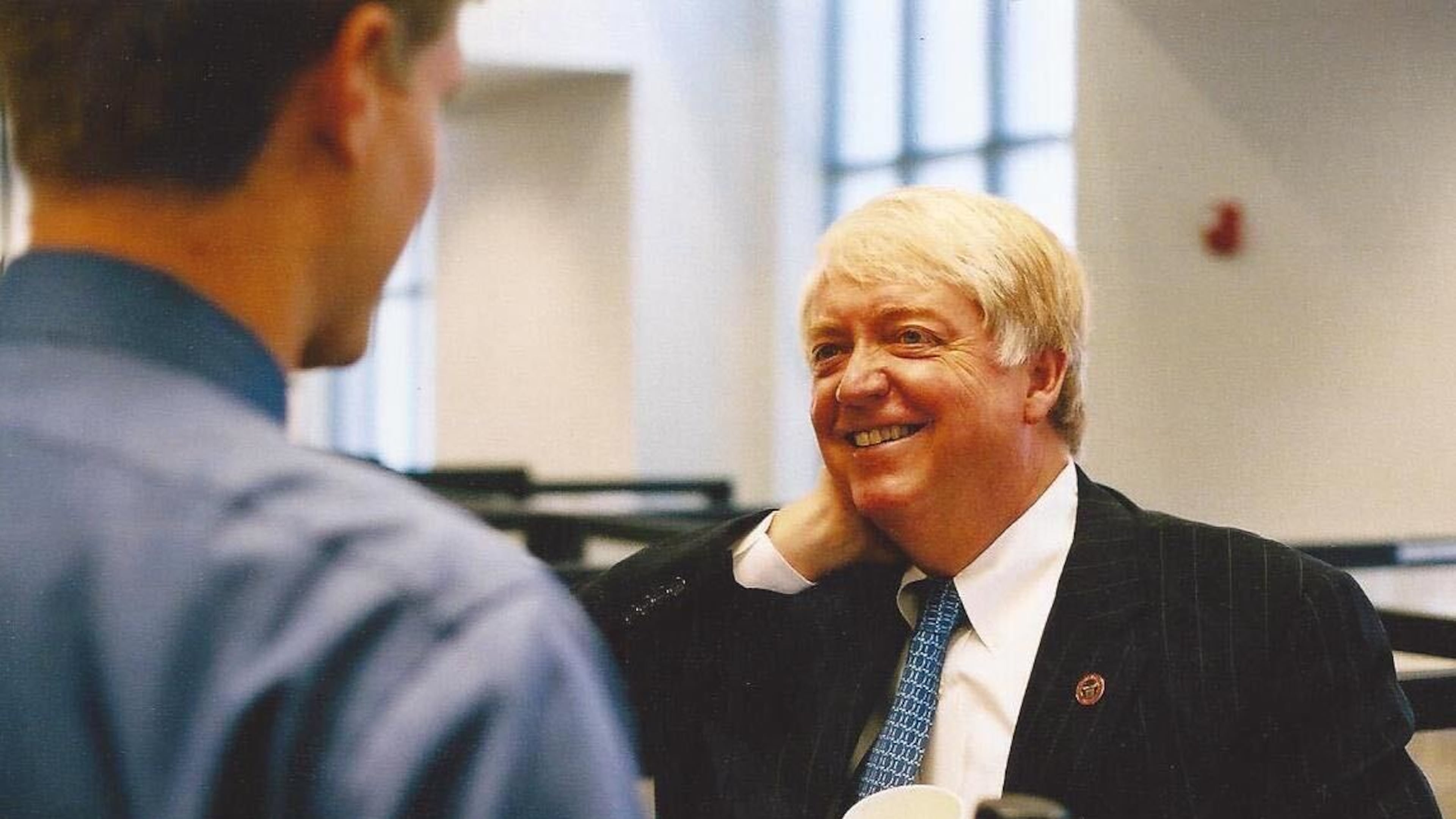 Then-University of Georgia President Michael Adams speaks with Greg Bluestein at the Athens headquarters of The Red & Black student newspaper in 2003. (Provided by Greg Bluestein)