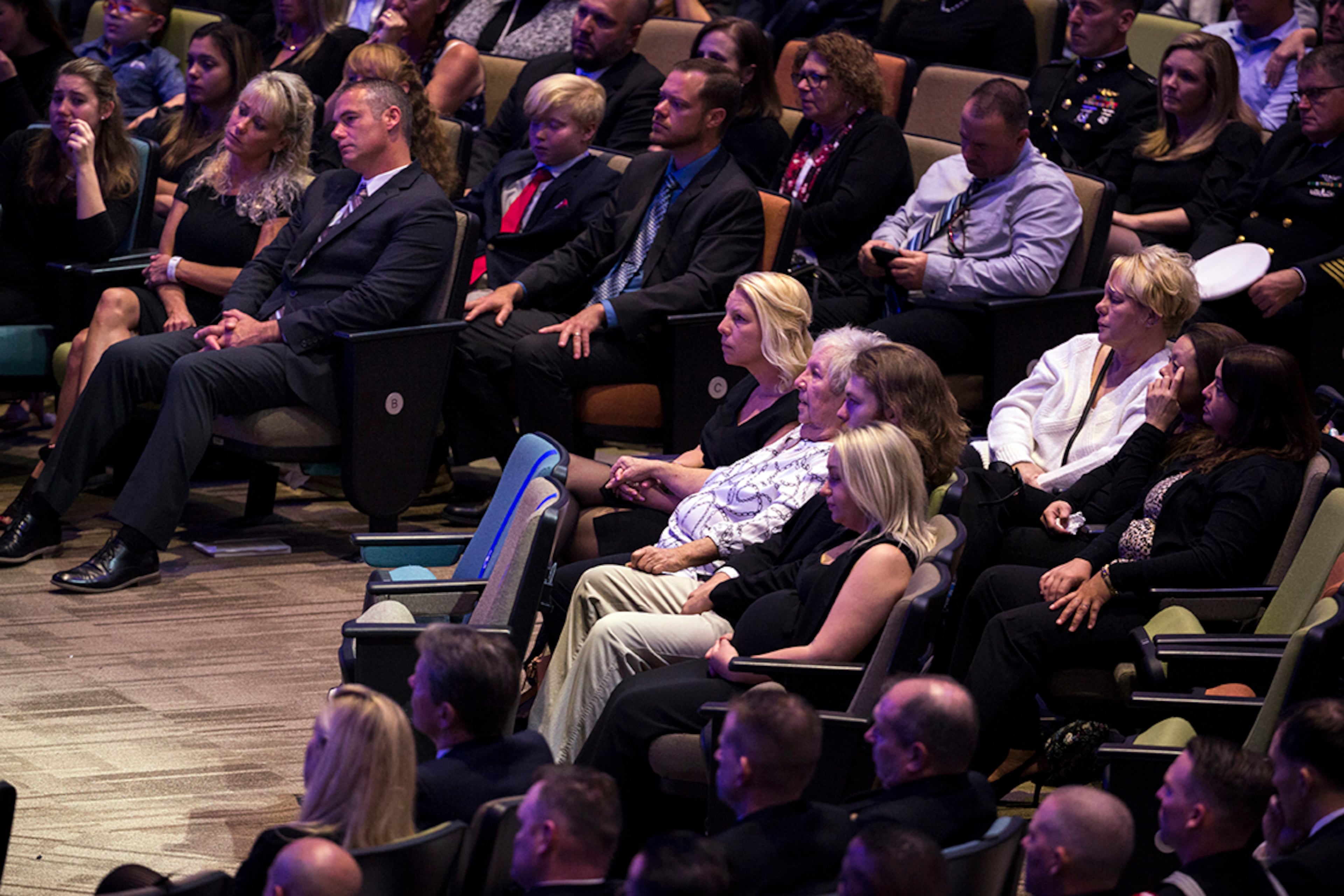 SAVANNAH, GA - DECEMBER 16, 2019: Members of the Walters family listen to a speaker during a funeral service for U.S. Navy Airmen Apprentice Cameron Walters at the Compassion Christian Church Henderson in Savannah, Georgia. Walters was one of the three sailors killed in the shooting this month at Naval Air Station Pensacola. (AJC Photo/Stephen B. Morton)