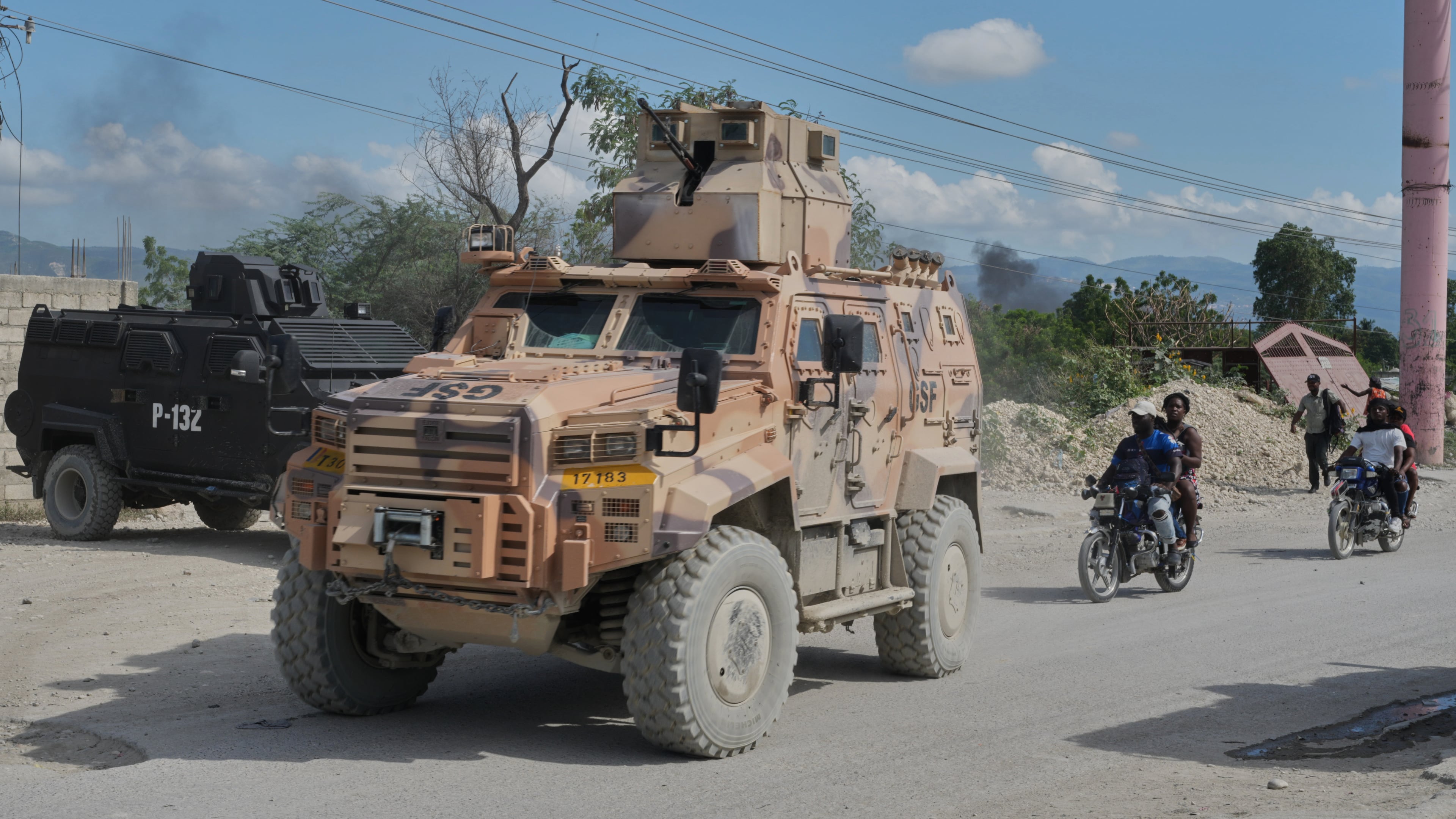Armored police vehicles that are part of the Gang Suppression Force (GSF) patrol the Tabarre neighborhood of Port-au-Prince, Haiti, Monday, Oct. 19, 2026. (AP Photo/Odelyn Joseph)