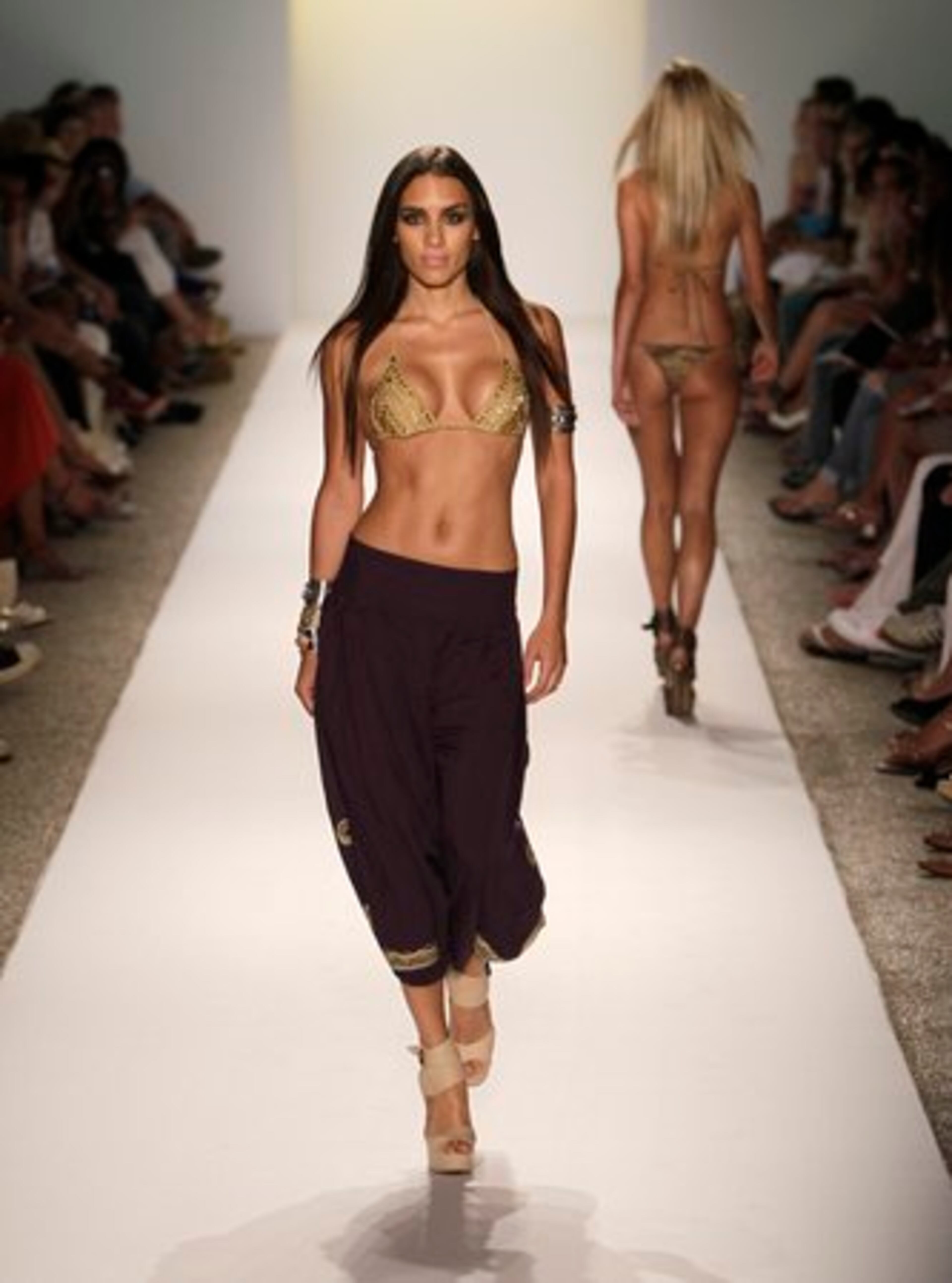 A model walks down the runway during the Cia.Maritima show at the Mercedes-Benz Fashion Week Swim 2011 in Miami Beach, Fla.