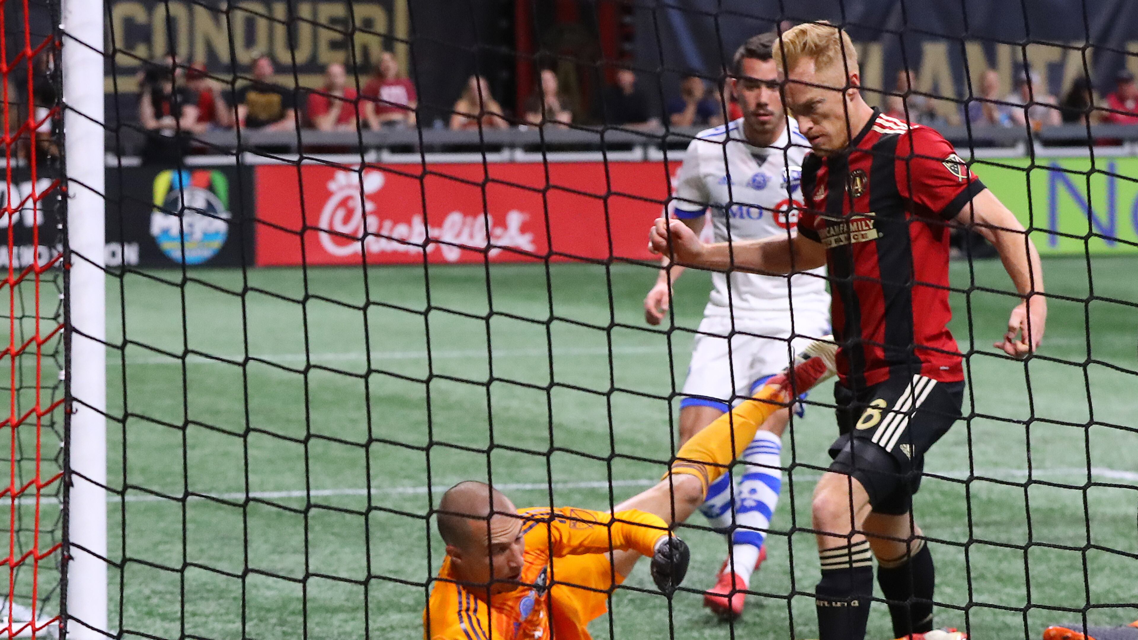 April 28, 2018 Atlanta: Atlanta United midfielder Jeff Larentowicz scores an apparent goal past Montreal Impact goalkeeper Evan Bush but the United were ruled offsides on the play during the first half in a MLS soccer game on Saturday, April 28, 2018, in Atlanta. Curtis Compton/ccompton@ajc.com