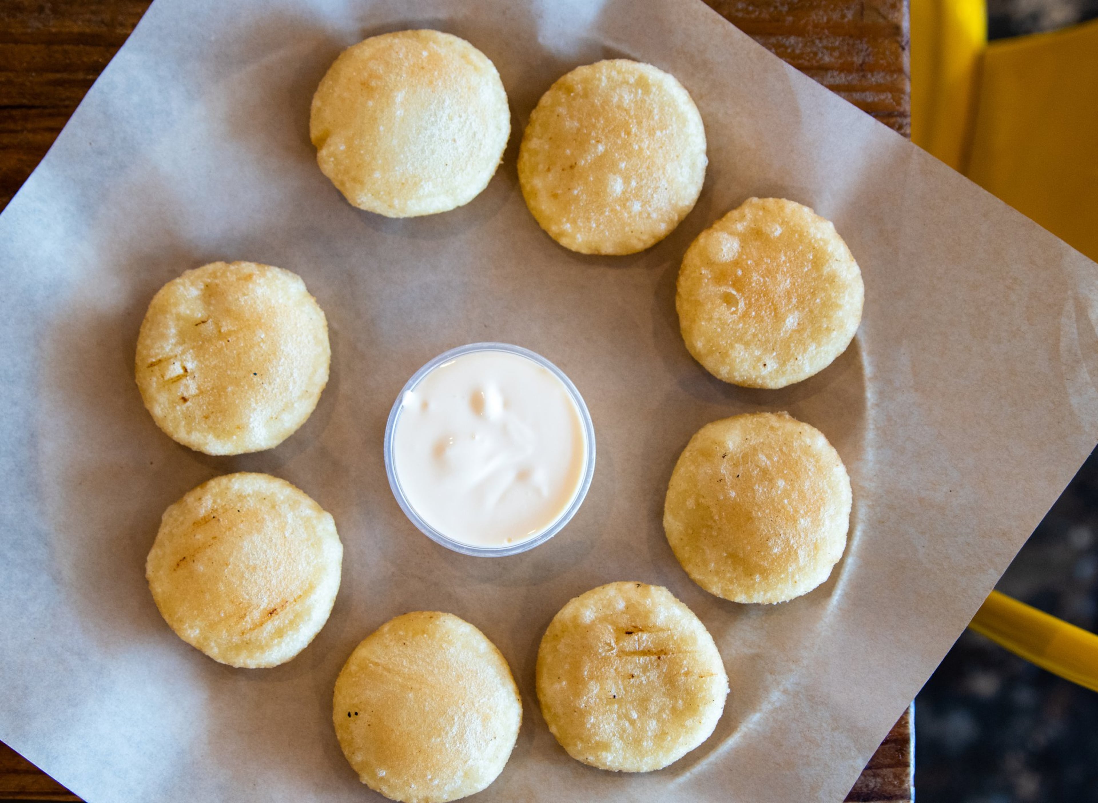 Arepa Mia makes arepitas fritas, fried miniature arepas served with nata, a creamy, milk-based condiment. CONTRIBUTED BY HENRI HOLLIS