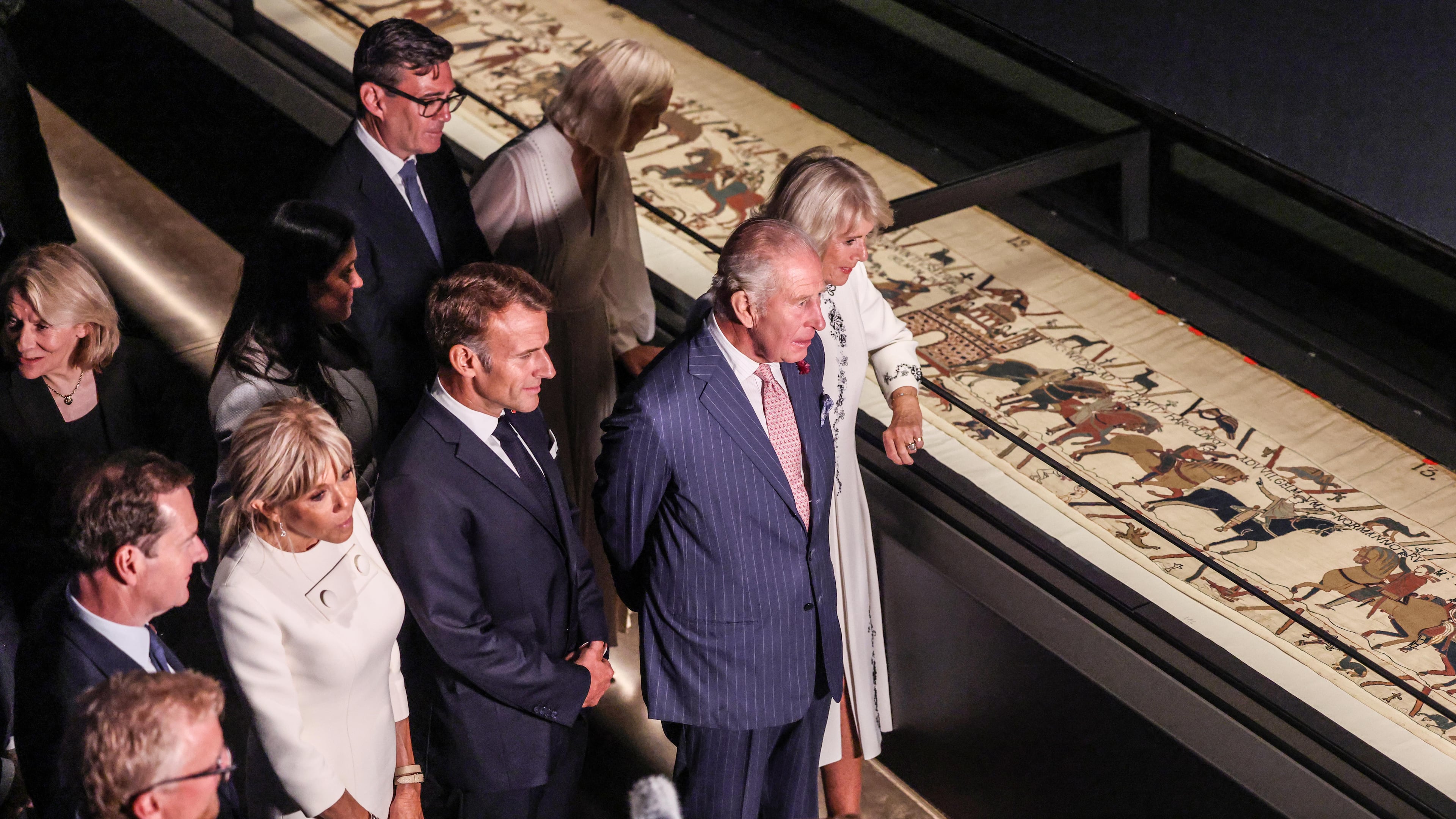 Britain's King Charles III and Queen Camilla, accompanied by The President of France Emmanuel Macron and Brigitte Macron, the Prime Minister, Andy Burnham and his wife Marie-France Van-Heel, view the Bayeux Tapestry Exhibition at the British Museum in London Wednesday, Sept. 2, 2026. (Richard Pohle, Pool Photo via AP)