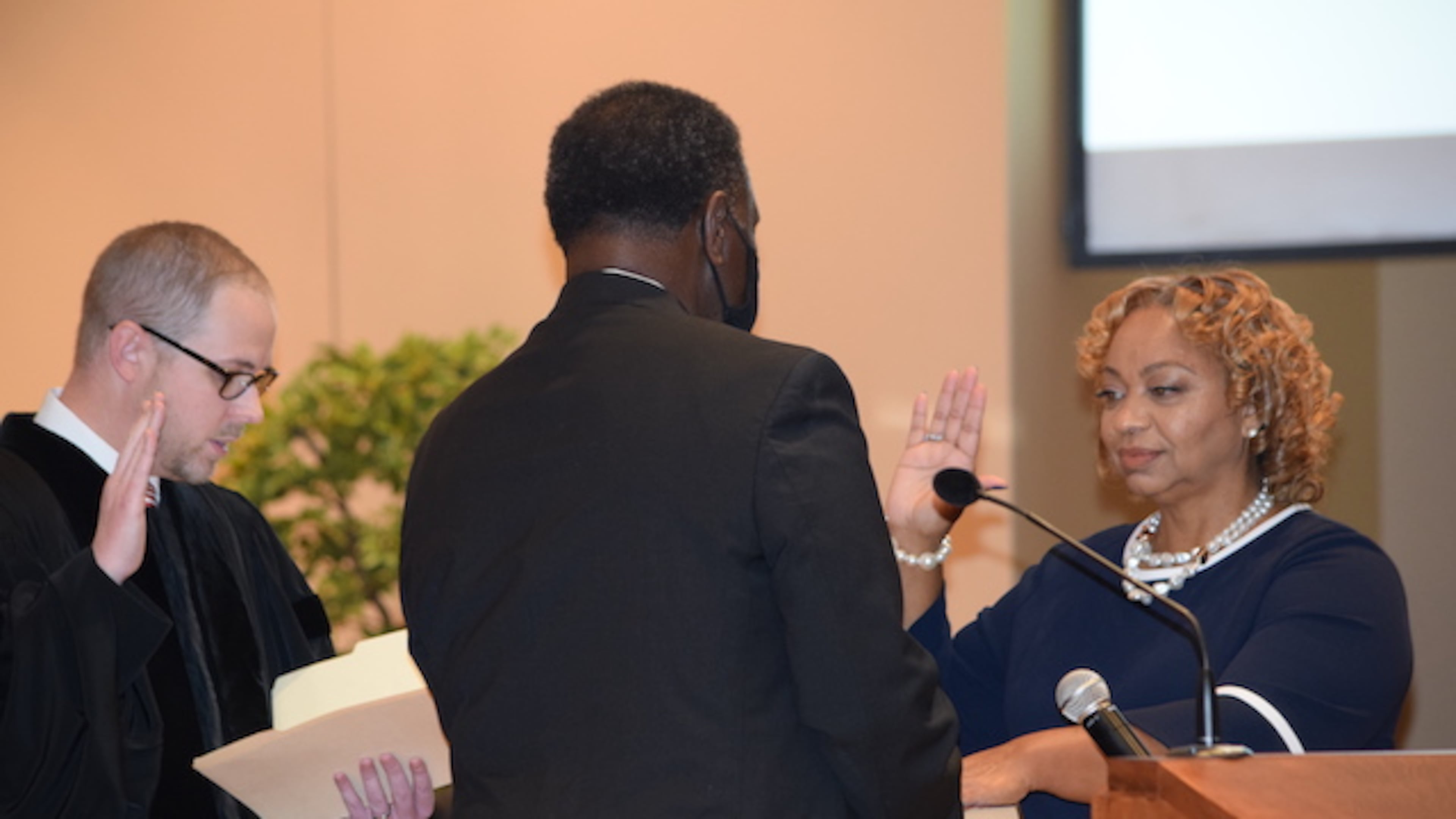 Carlotta Harrell takes the oath of office.