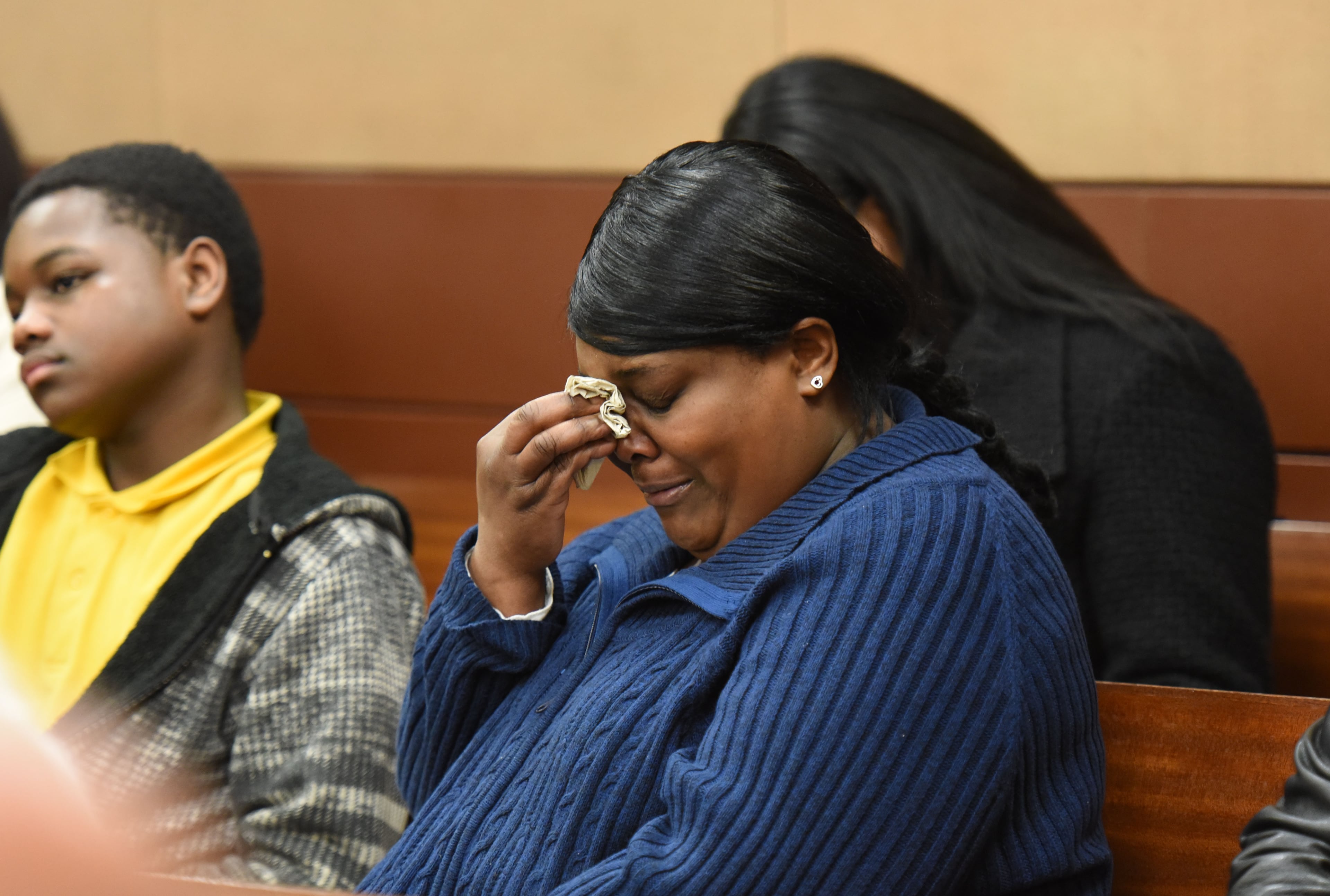 A family member of Brandon Jerome Smith, 19, reacts at Fulton County Superior Court on Thursday, Jan. 28, 2016. Brandon Jerome Smith, who turned 19 on Jan. 21, was sentenced to life in prison, plus 20 years and an additional five years for the violent home invasion in August. HYOSUB SHIN / HSHIN@AJC.COM