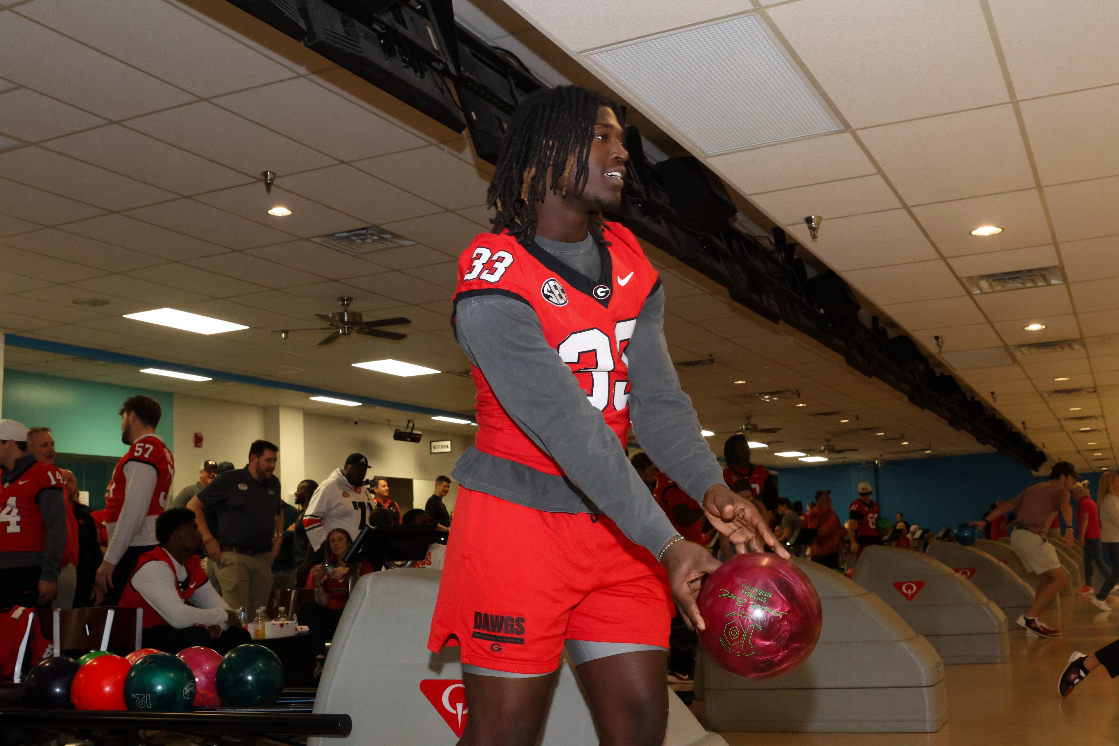 UGA outside linebacker Quintavius Johnson bowls during the third annual Chick-fil-A Dawg Bowl fundraiser for Parkinson’s and Crohn’s disease research at Showtime Bowl in Athens on Wednesday, Oct. 22, 2025. (C.J. Bartunek for the AJC)