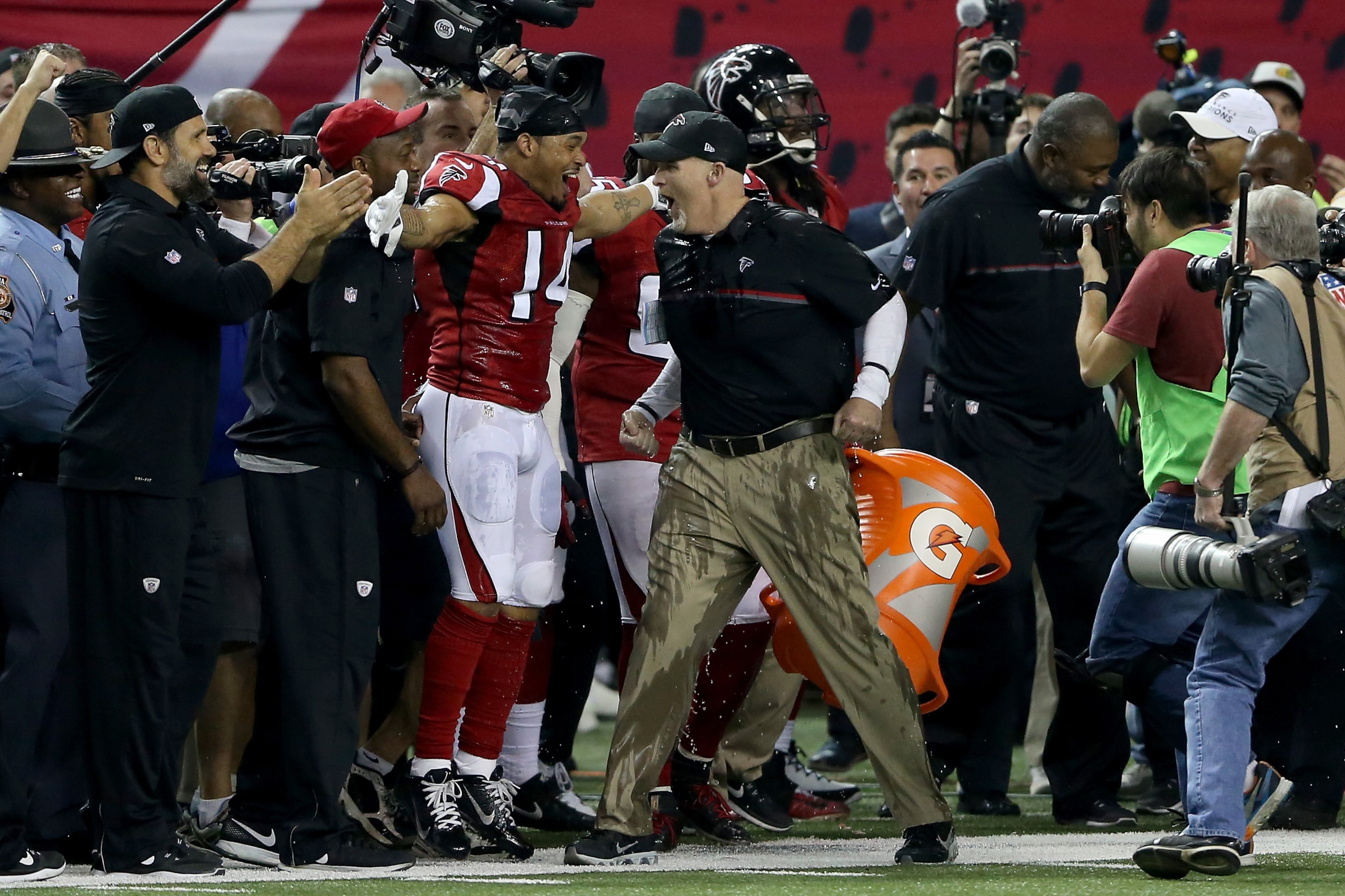ATLANTA, GA - JANUARY 22: Head coach Dan Quinn of the Atlanta Falcons has gatorade dumped on him by his team late in the game against the Green Bay Packers in the NFC Championship Game at the Georgia Dome on January 22, 2017 in Atlanta, Georgia. (Photo by Streeter Lecka/Getty Images)