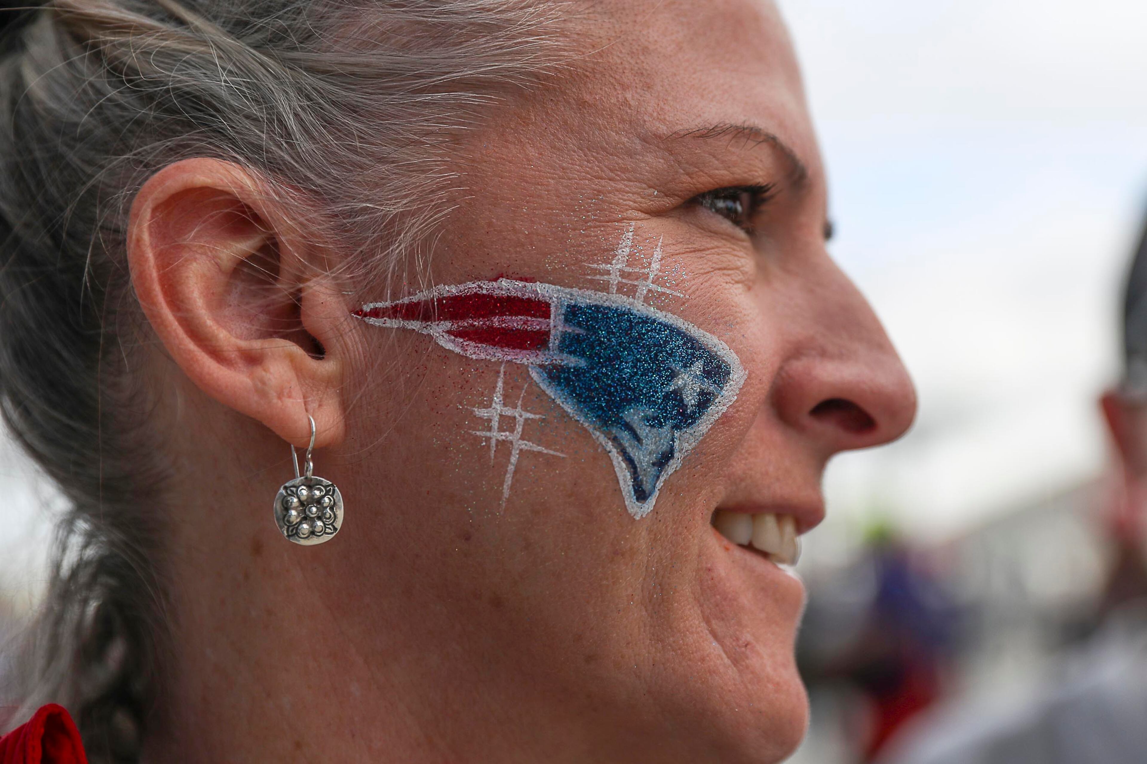 02/03/2019 -- Atlanta, Georgia -- A New England Patriots fan shows off her face paint before the start of the NFL Super Bowl 53 football game at Mercedes-Benz Stadium, Sunday, February 3, 2019. (ALYSSA POINTER/ALYSSA.POINTER@AJC.COM)