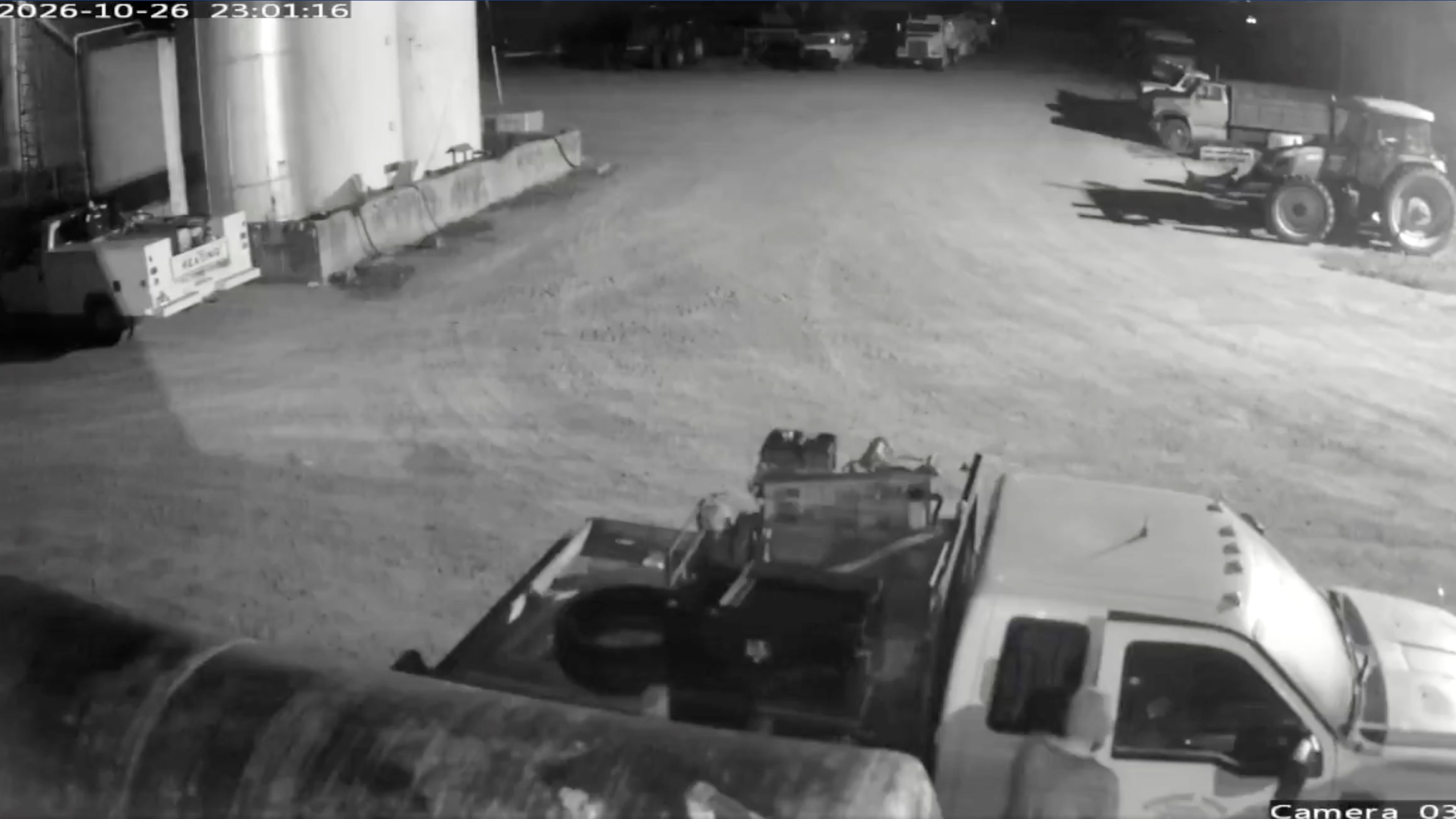 This image from security video provided by John Lindamood shows escaped inmate Jacob Allen Morley, bottom right, stealing a white Ford F-350 from the Lindamood Planting Company early Monday, Oct. 26, 2026, in Lake County, Tenn. (John Lindamood via AP)