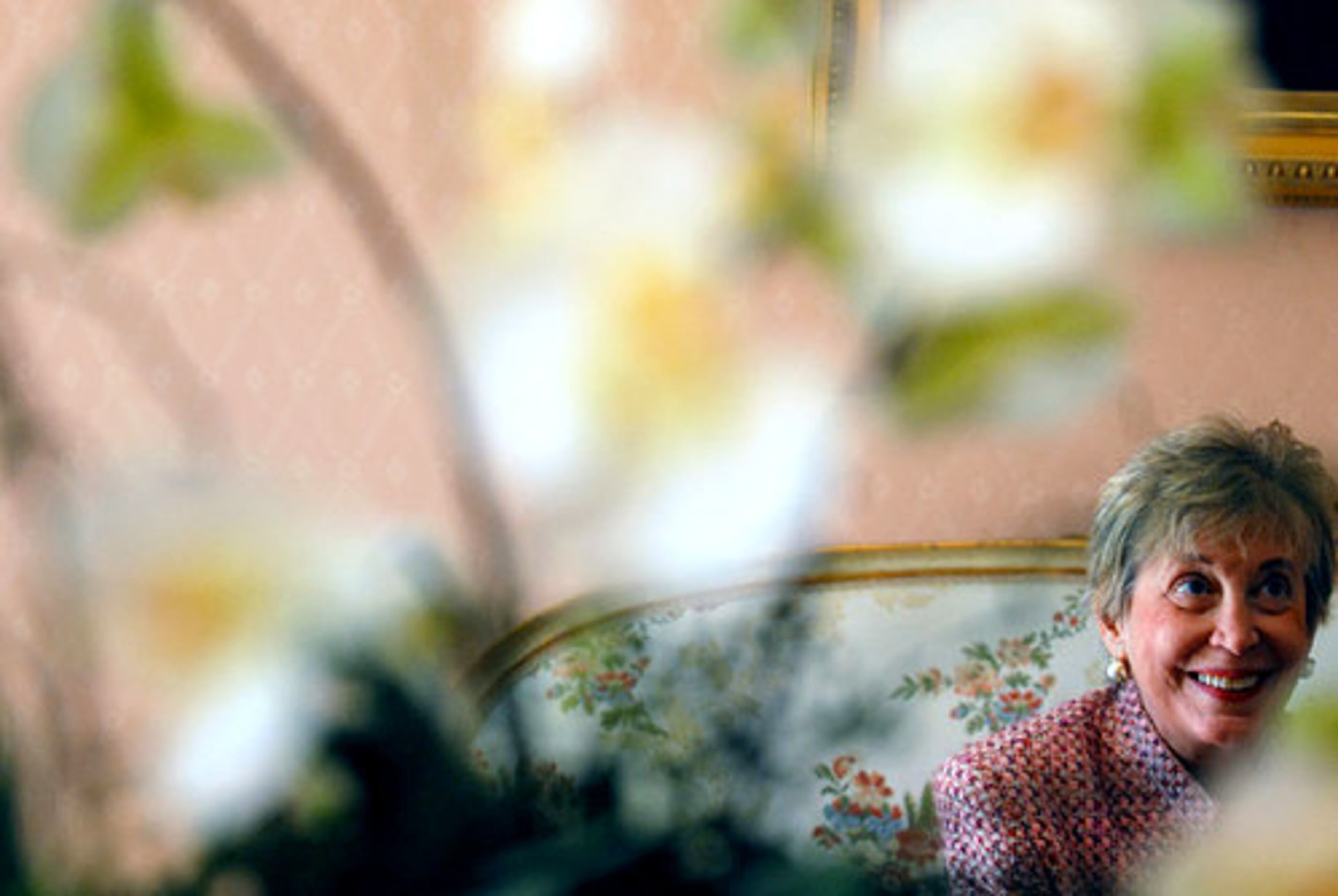 Anne Colginof is shown in the reflection of a mirror in the entryway of her home, which will be part of the Buckhead in Bloom tour on April 6.