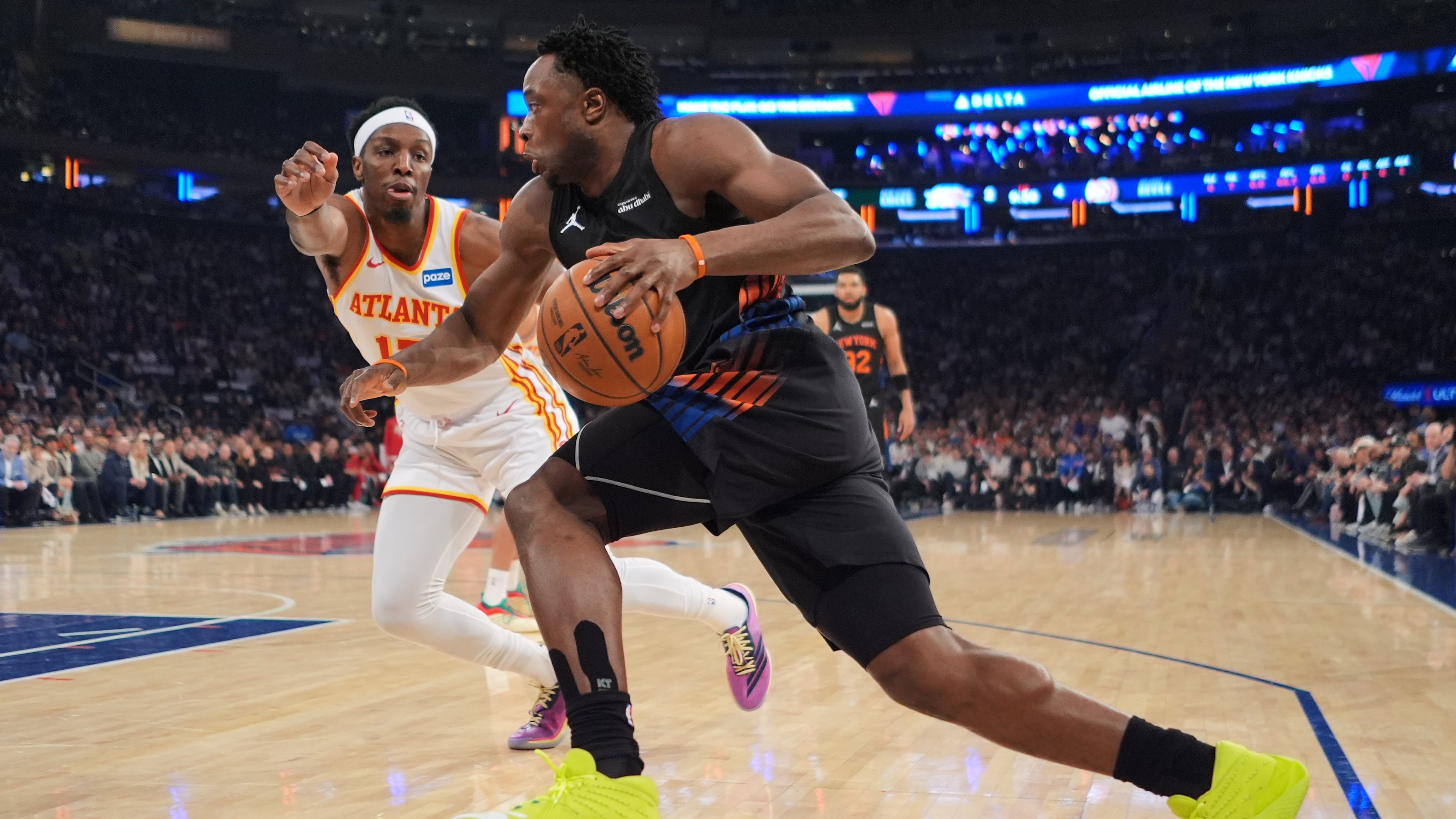 New York Knicks' OG Anunoby, right, drives past Atlanta Hawks' Onyeka Okongwu during the first half in Game 5 of a first-round NBA playoffs basketball series, Tuesday, April 28, 2026, in New York. (AP Photo/Frank Franklin II)