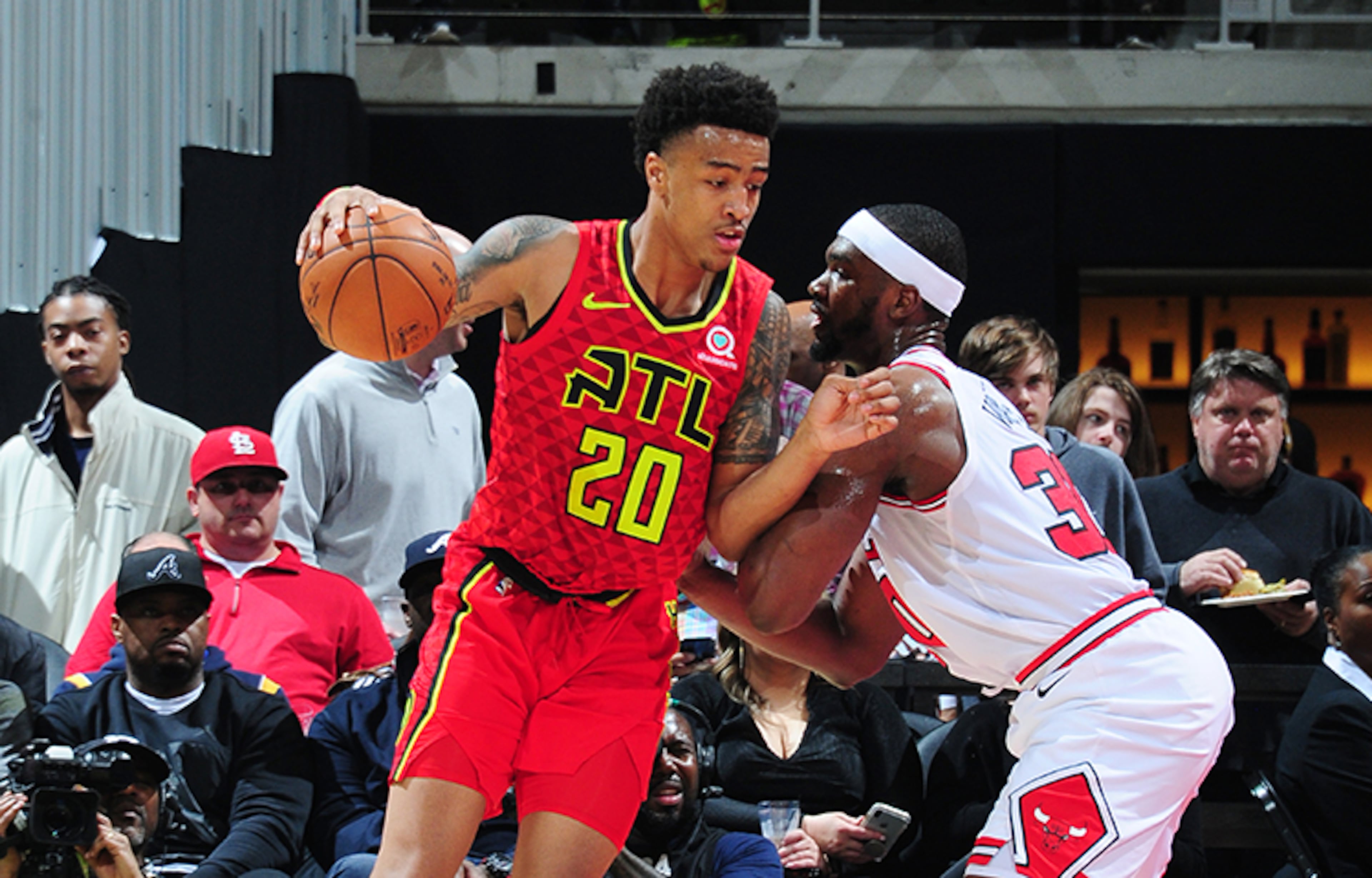 In this file photo John Collins #20 of the Atlanta Hawks handles the ball against the Chicago Bulls on March 11, 2018 at Philips Arena in Atlanta, Georgia.