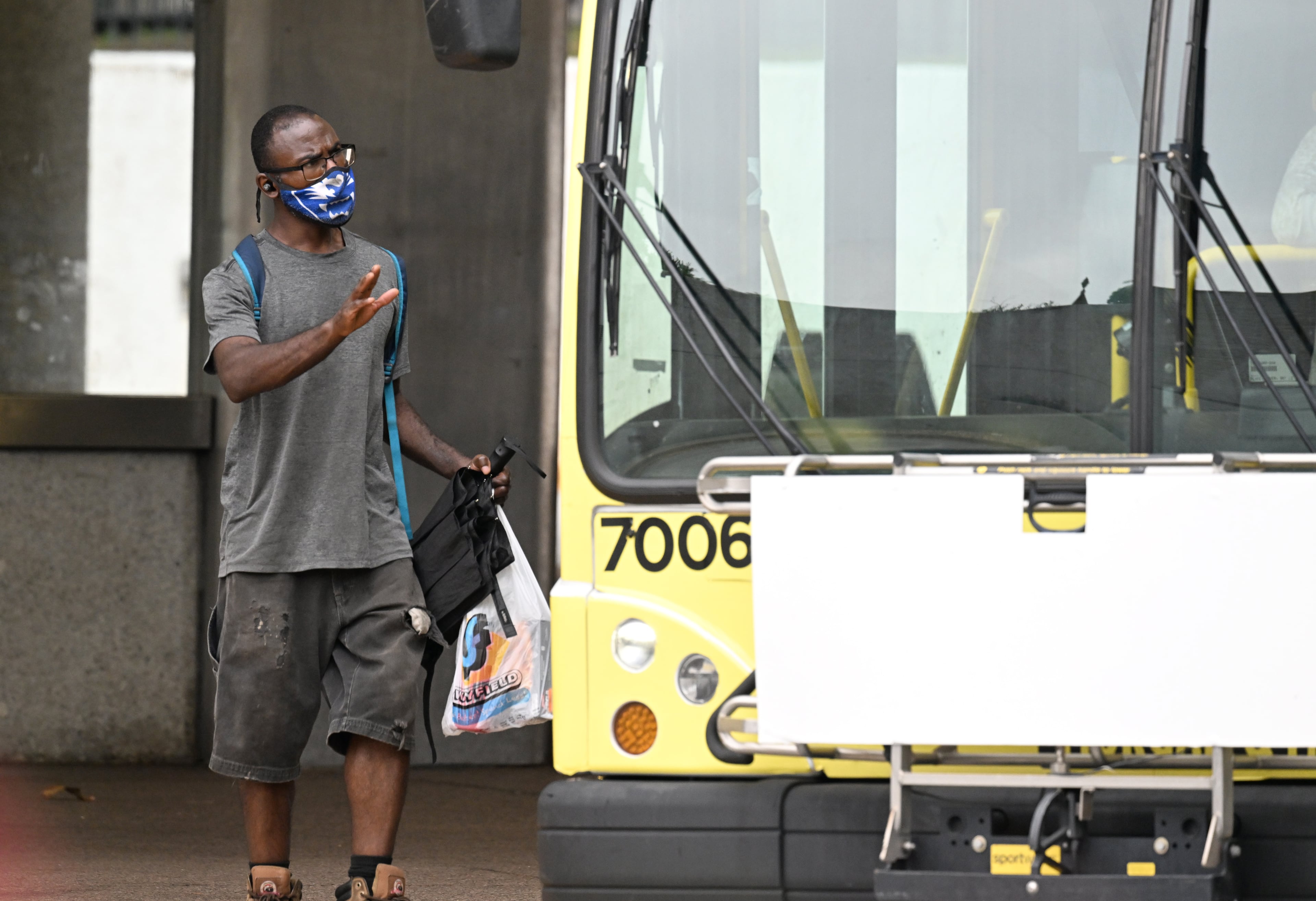 July 19, 2022 Atlanta - A masked customer catches a bus at Marta’s North Avenue station in Atlanta on Tuesday, July 19, 2022. A new strain of the coronavirus is driving a fresh surge of cases in Georgia, with much of the state and all of metro Atlanta experiencing high levels of COVID-19 transmission, according to federal data. (Hyosub Shin / Hyosub.Shin@ajc.com)