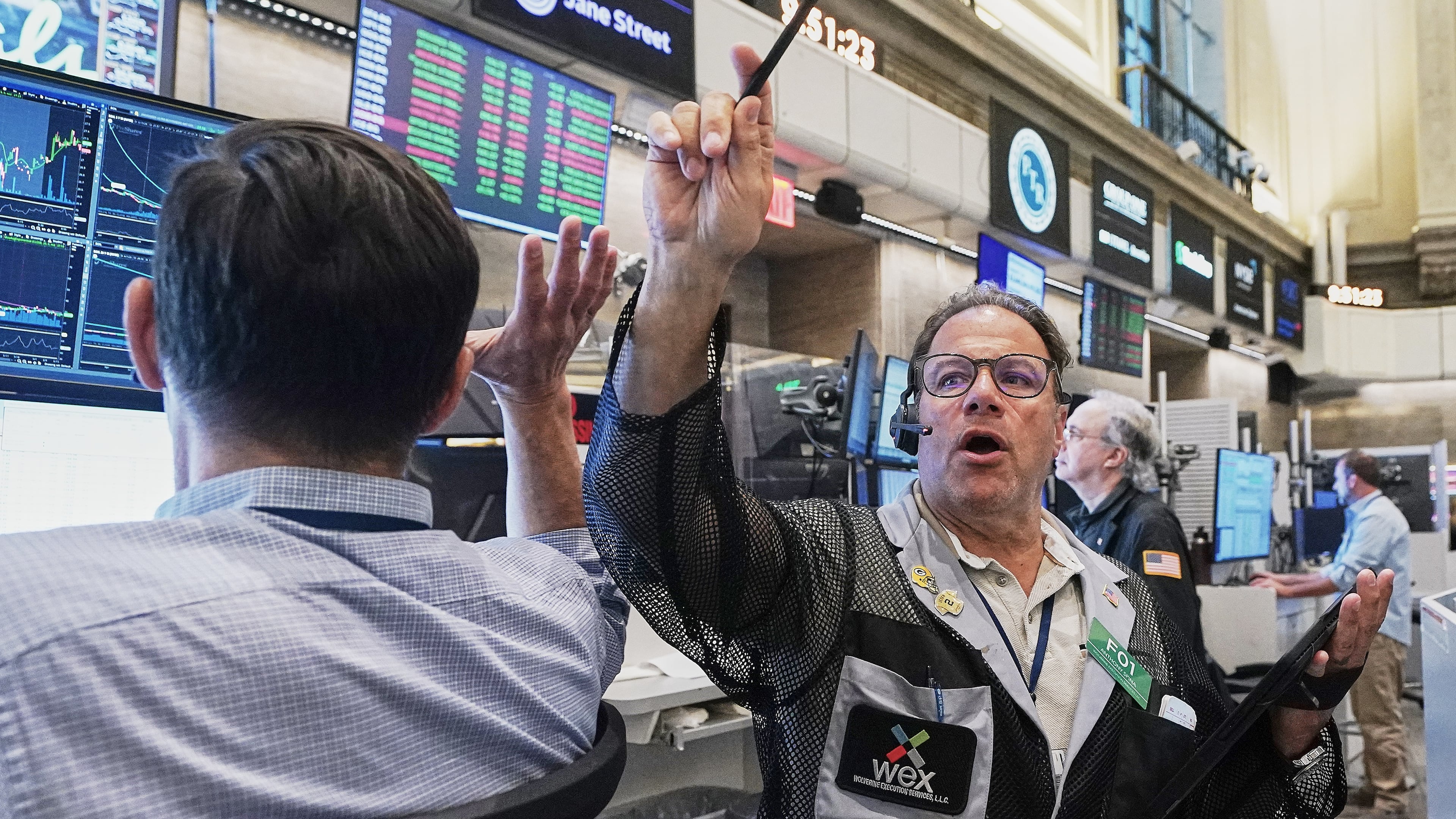 FILE - Options trader Anthony Spina, center, works on the floor of the New York Stock Exchange on June 16, 2026. (AP Photo/Richard Drew, File)