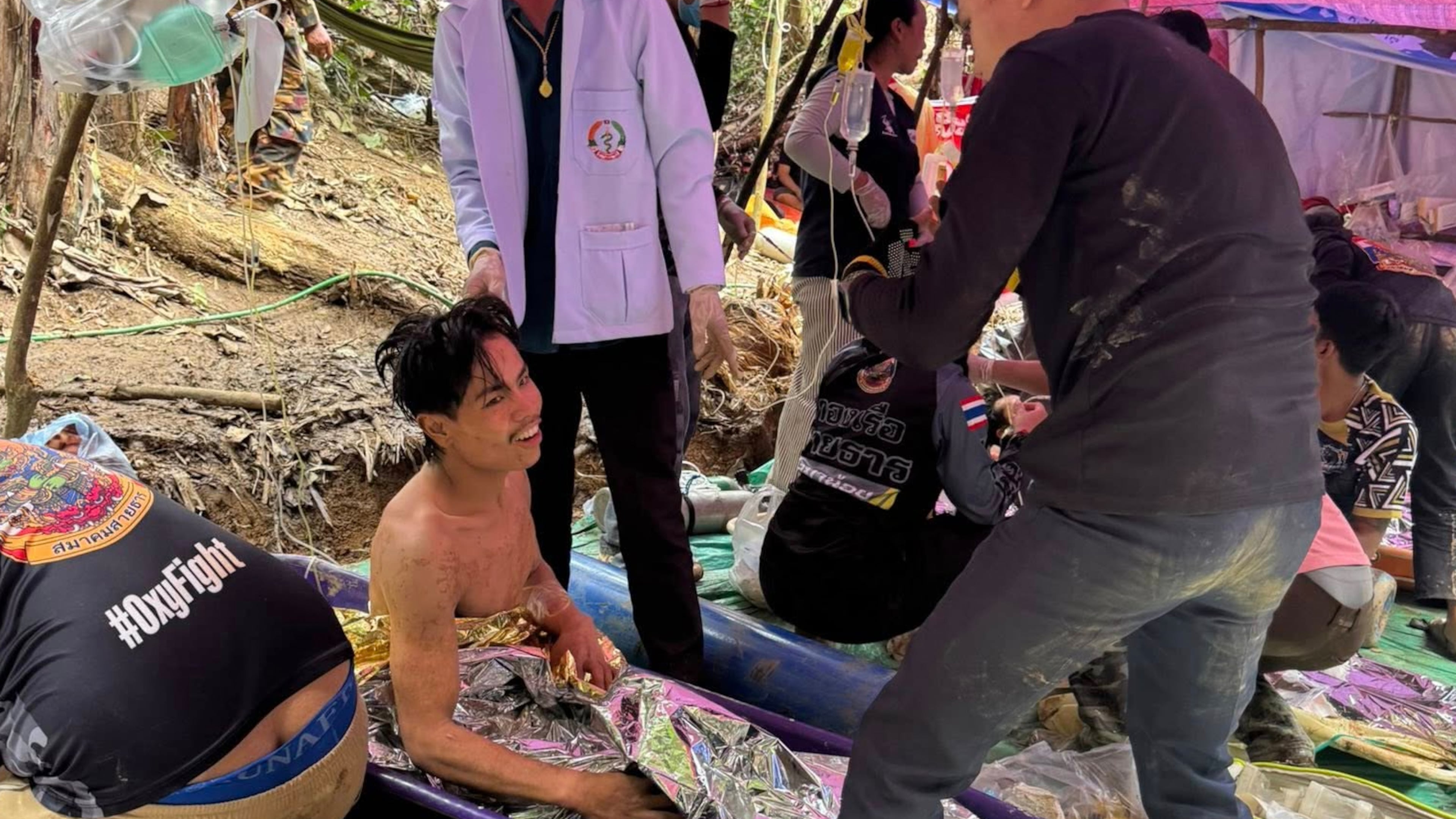 This image provided by the Association Of Volunteers For Lao People, shows rescuers after they safely evacuated the villagers, who had been trapped in a cave in Xaisomboun province, Laos, Saturday, May 30 , 2026. (Association Of Volunteers For Lao People via AP)
