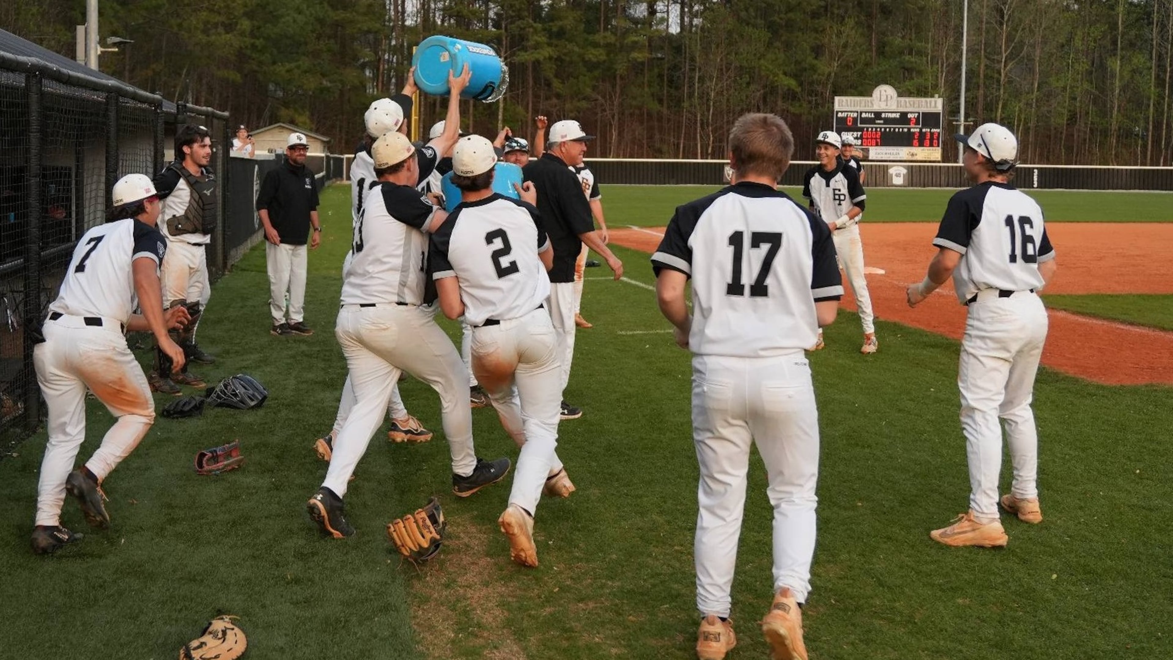 East Paulding players celebrate coach Tony Boyd's 600th victory March 27 in a 15-2 victory over Rome. (Courtesy of East Paulding High School)