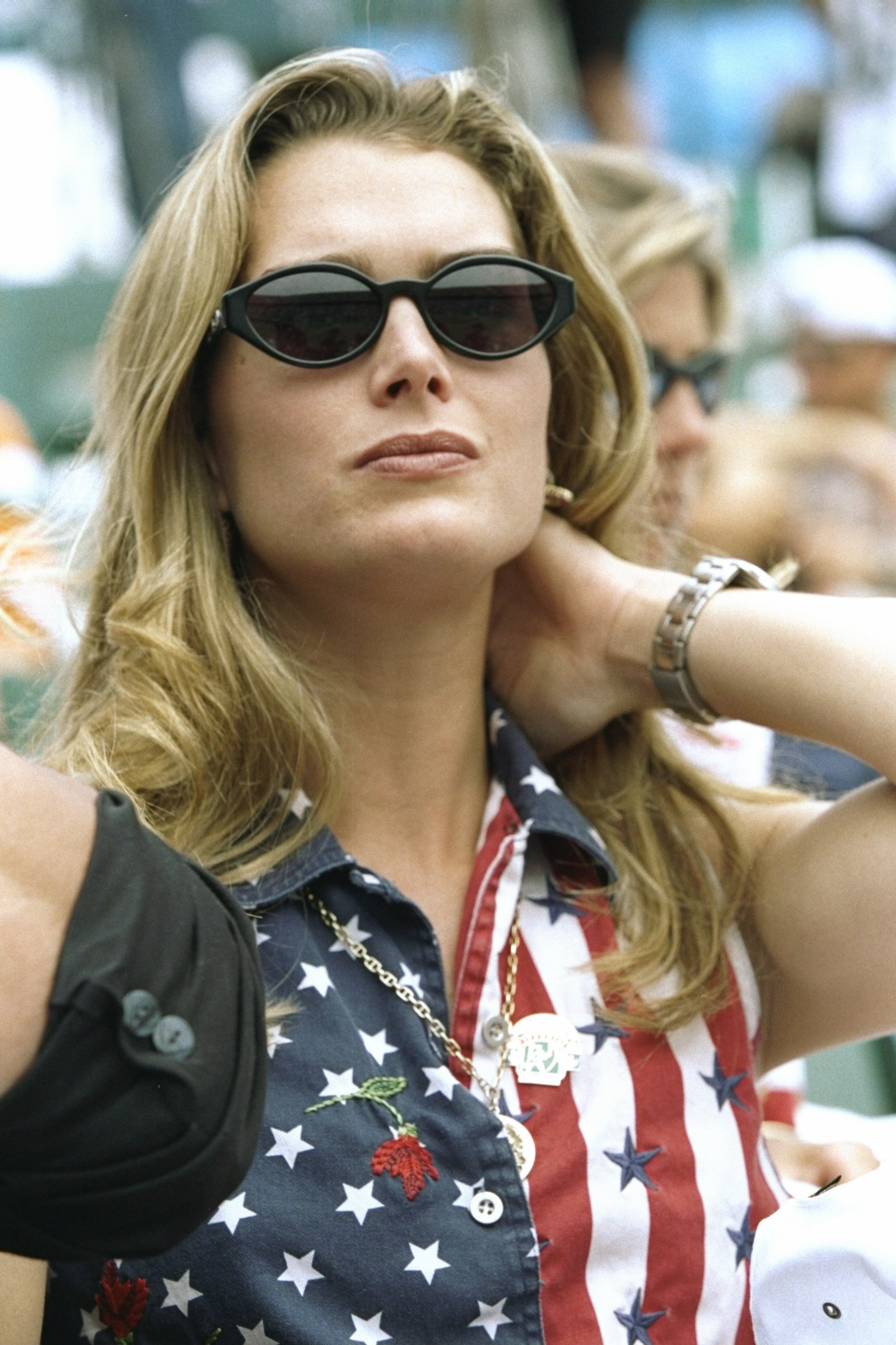 Actress Brooke Shields watches her boyfriend Andre Agassi play the gold medal match. (Photo by Gary M. Prior/Getty Images)
