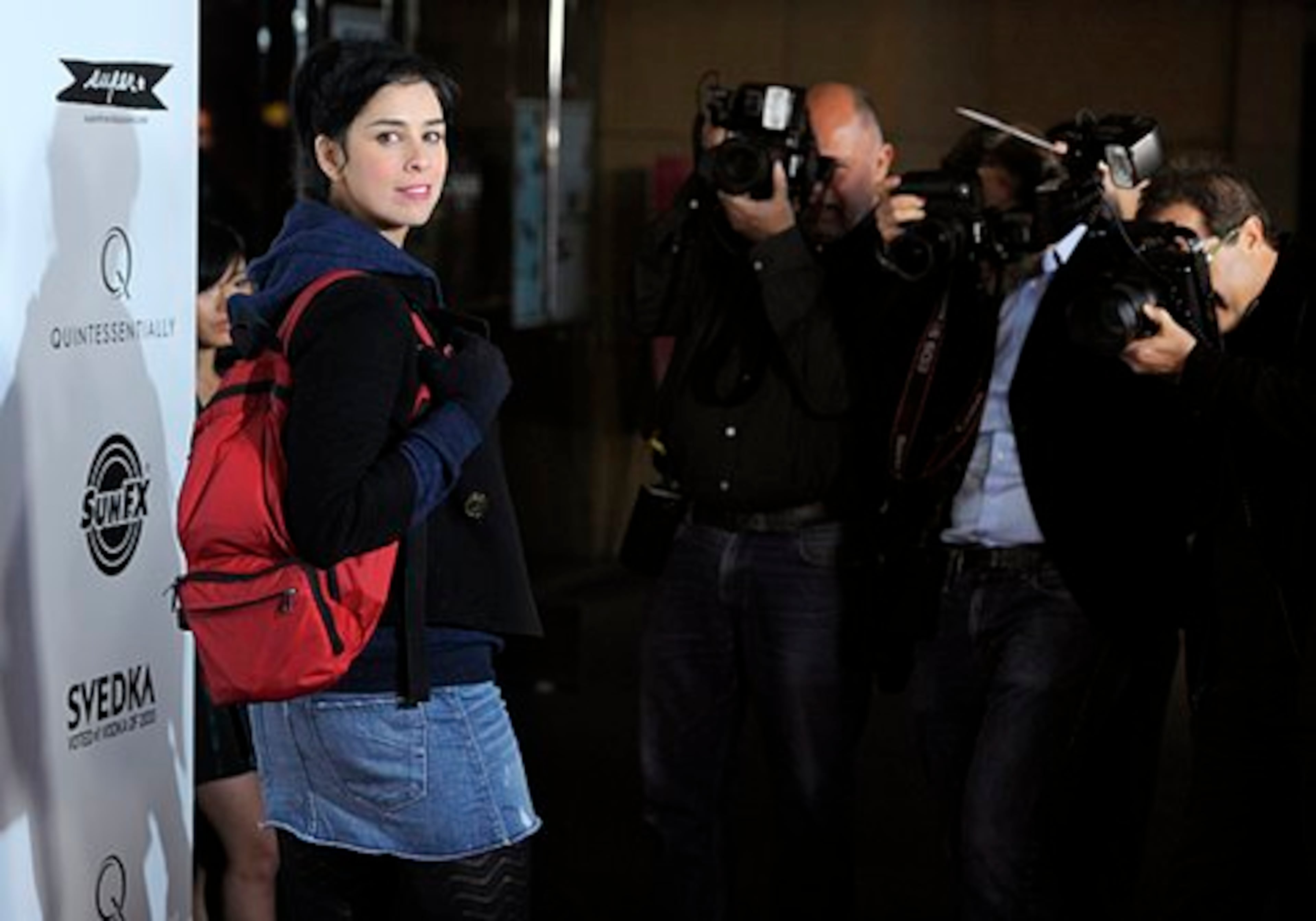 Comedian Sarah Silverman works the red carpet in here cut-off jean skirt/leggings/hoodie/backpack ensemble.