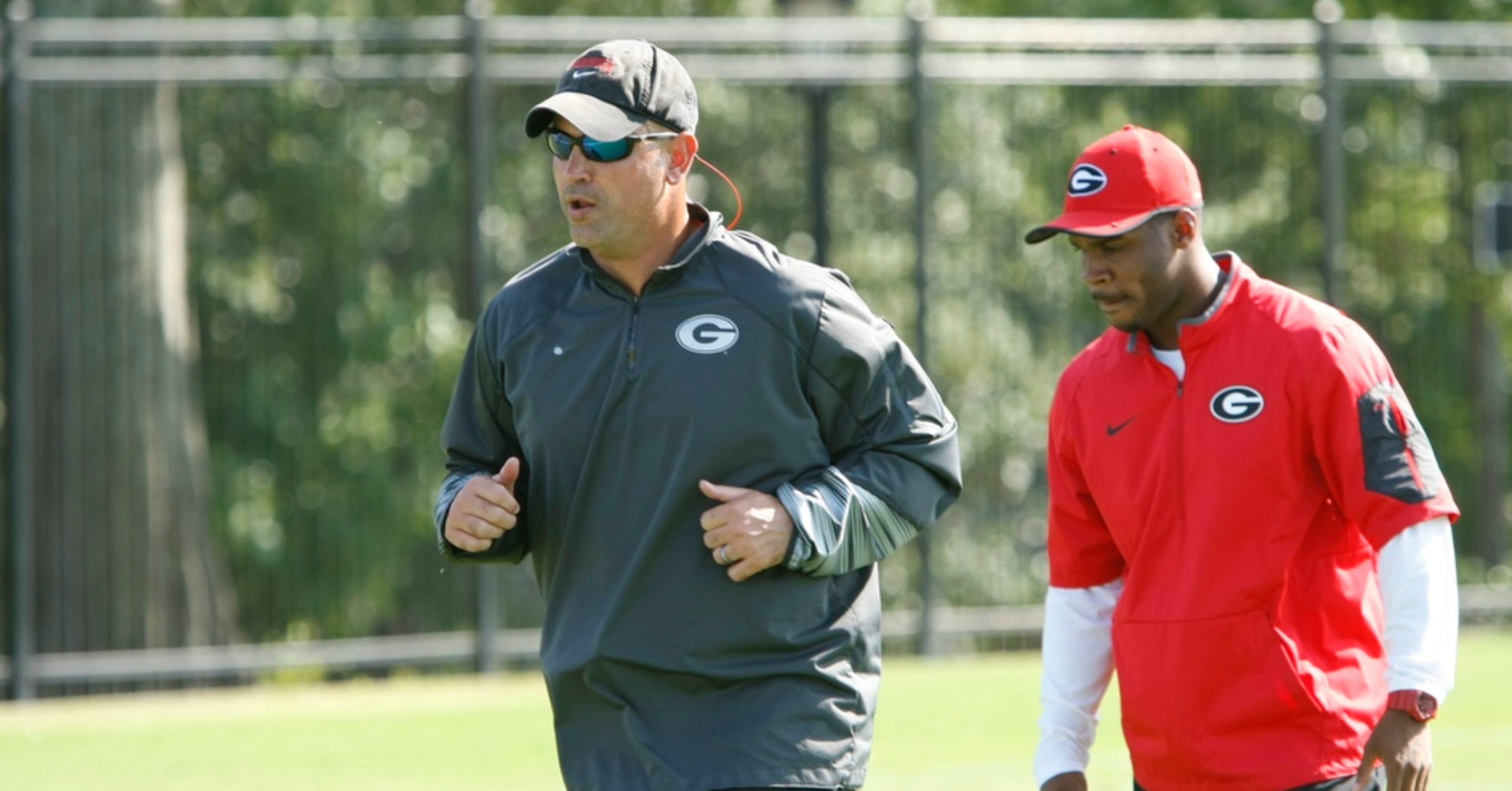 UGA defensive coordinator Jeremy Pruitt moves on to the next drill during Tuesday's practice. Many feel that Pruitt has brought a new culture to the Georgia program, and will continue that in his second year with the team.