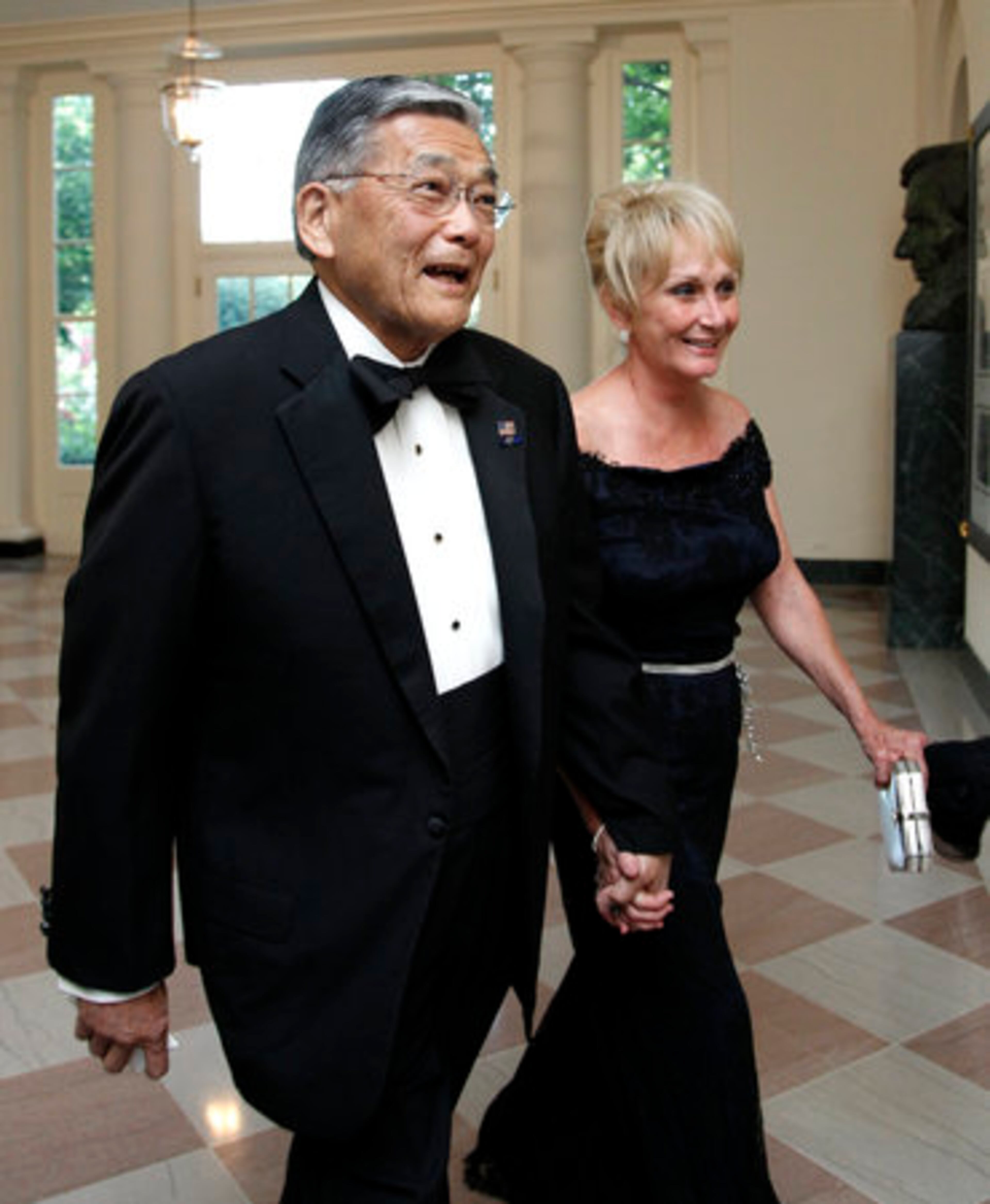 Former Transportation Secretary Norman Mineta, and his wife Deni Mineta arrive for a State Dinner hosted by President Barack Obama and first lady Michelle Obama in honor of German Chancellor Angela Merkel at the White House in Washington, Tuesday, June 7, 2011.