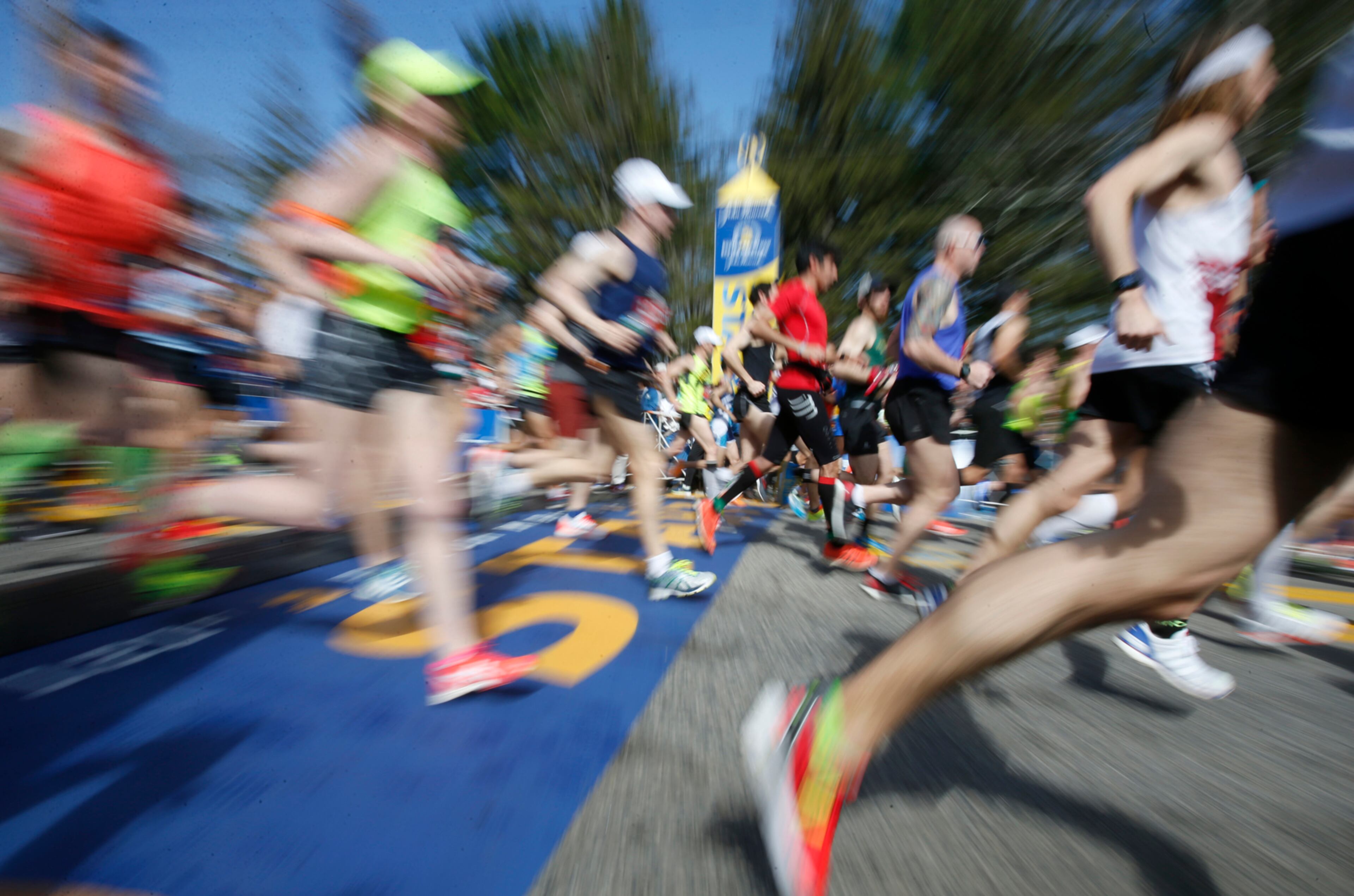 Runners cross the line at the start of the 2017 Boston Marathon in Hopkinton, Mass., Monday, April 17, 2017. (AP Photo/Mary Schwalm)