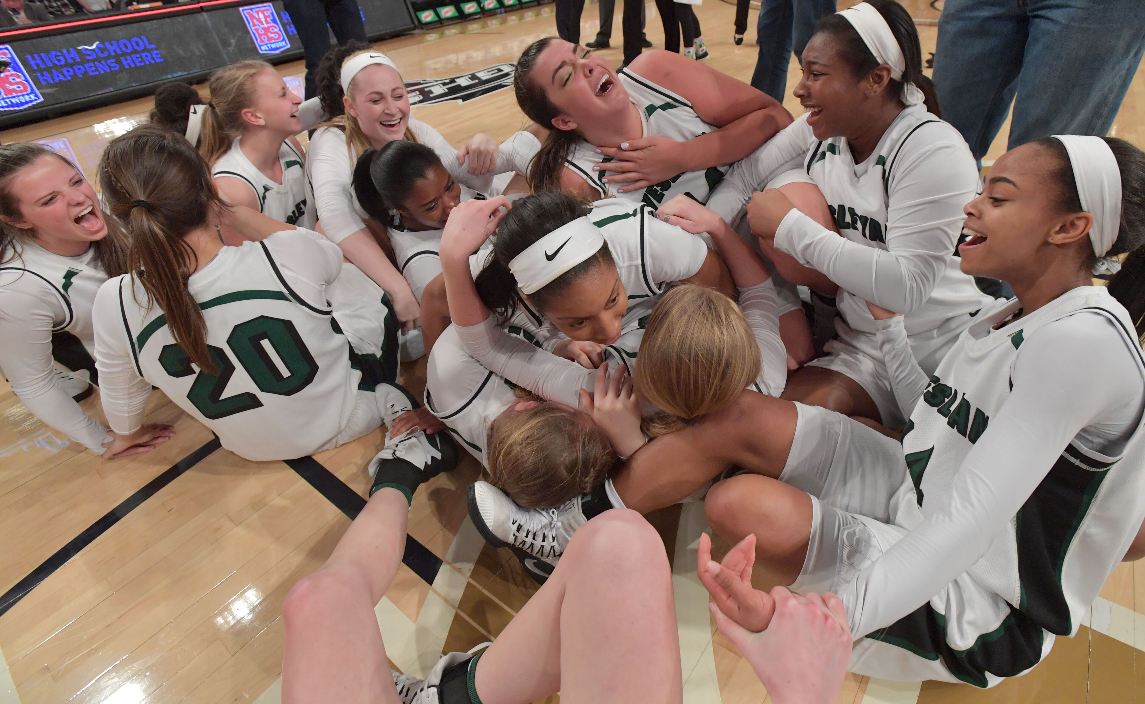March 10, 2017 Atlanta - Wesleyan players celebrate their win in GHSA 2017 State Basketball Championship game at Georgia Tech's McCamish Pavilion on Friday, March 10, 2017. Wesleyan won 51 - 48 over the Holy Innocents. HYOSUB SHIN / HSHIN@AJC.COM