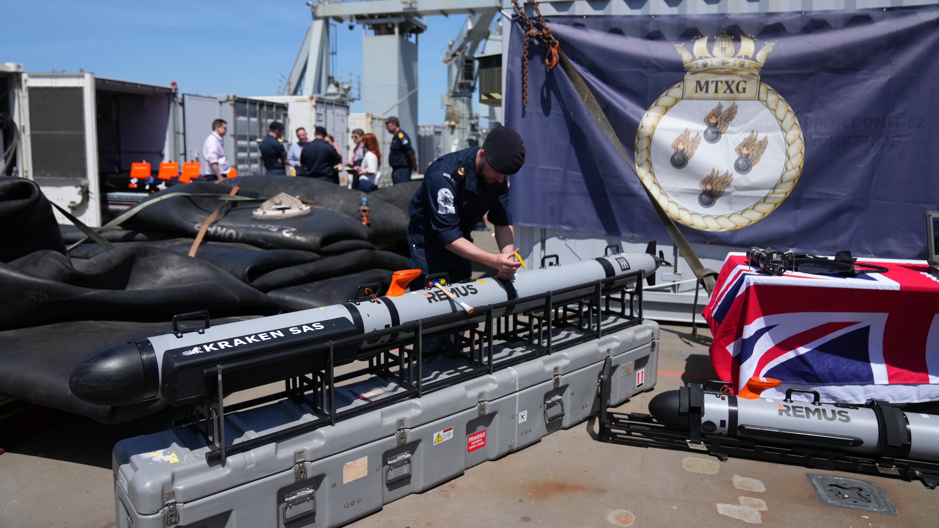UK Royal Navy personnel inspect autonomous vehicles with sonar sensor that can detect and identify mines, on RFA Lyme Bay in territory of Gibraltar, on Friday, May 22, 2026. (AP Photo/Kwiyeon Ha)