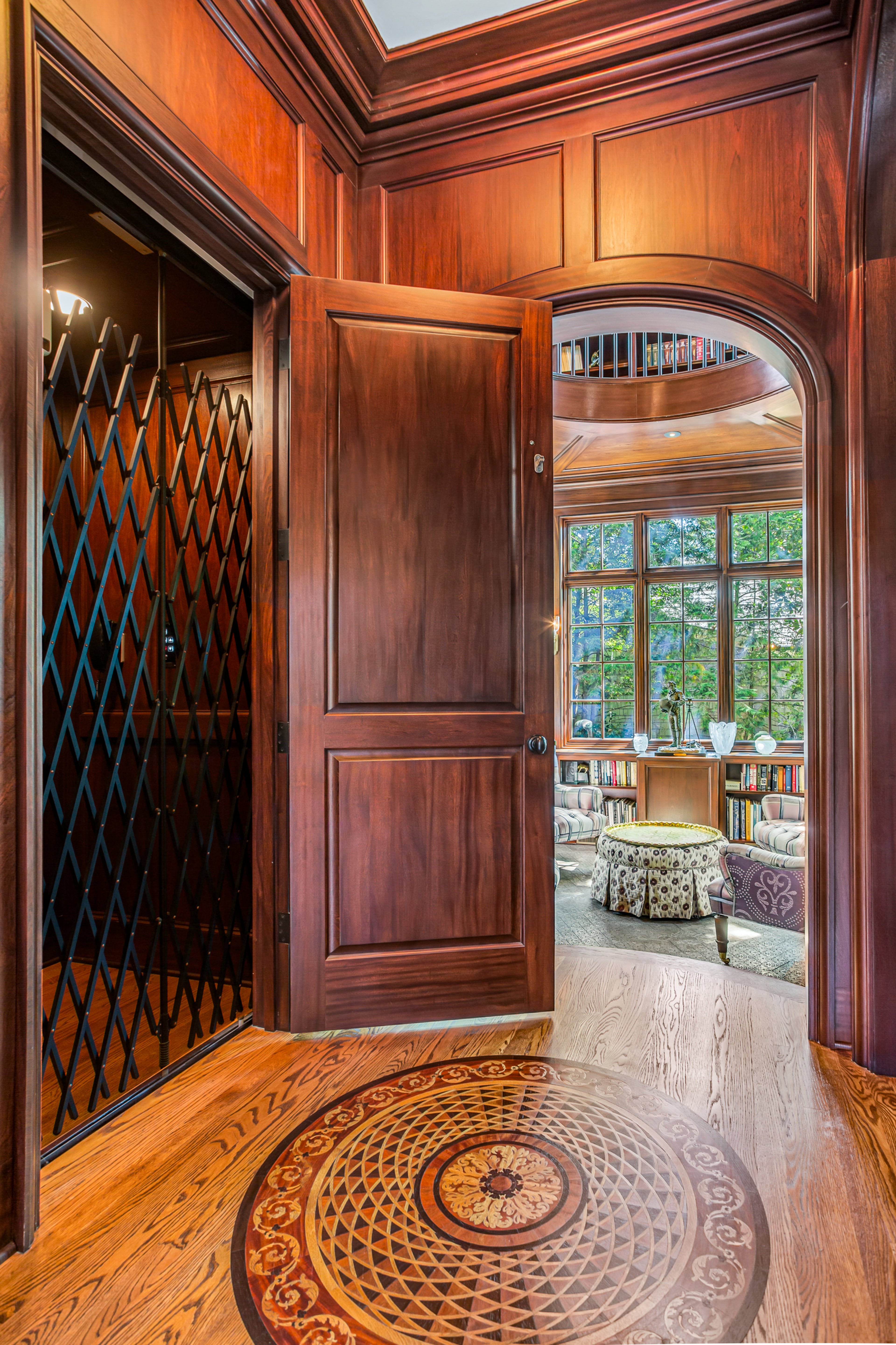Complimenting the library is a paneled elevator going to the second floor with access to the master bedroom. Text by Ansley Warren