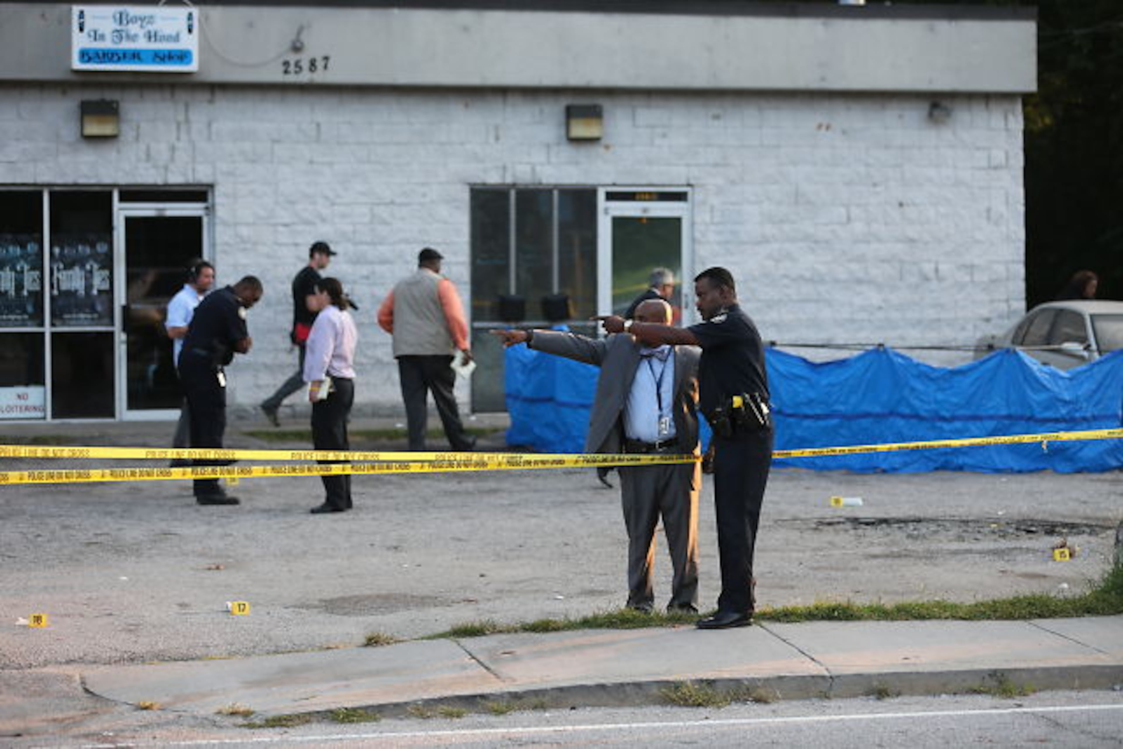 Atlanta homicide investigators were on the scene of fatal shooting in the 2500 block of Donald Lee Hollowell Parkway on Thurs., Aug. 27, 2015. JOHN SPINK / JSPINK@AJC.COM