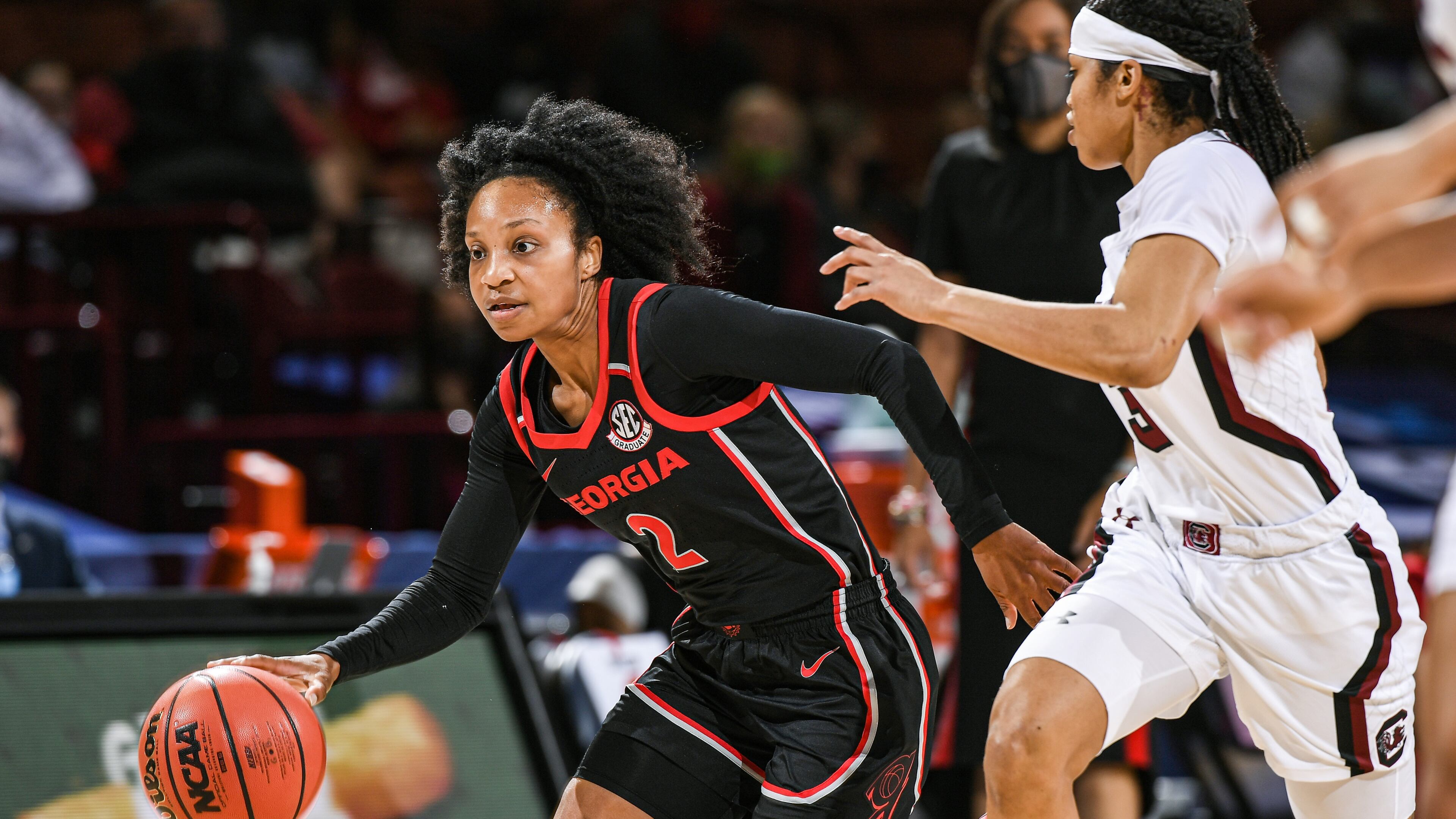 Georgia's Gabby Connally (2) drives by a South Carolina defender during the SEC Women's Basketball Tournament championship game on Sunday, March 7, 2021 in Greenville, SC. (By Todd Van Emst/UGA Athletics)
