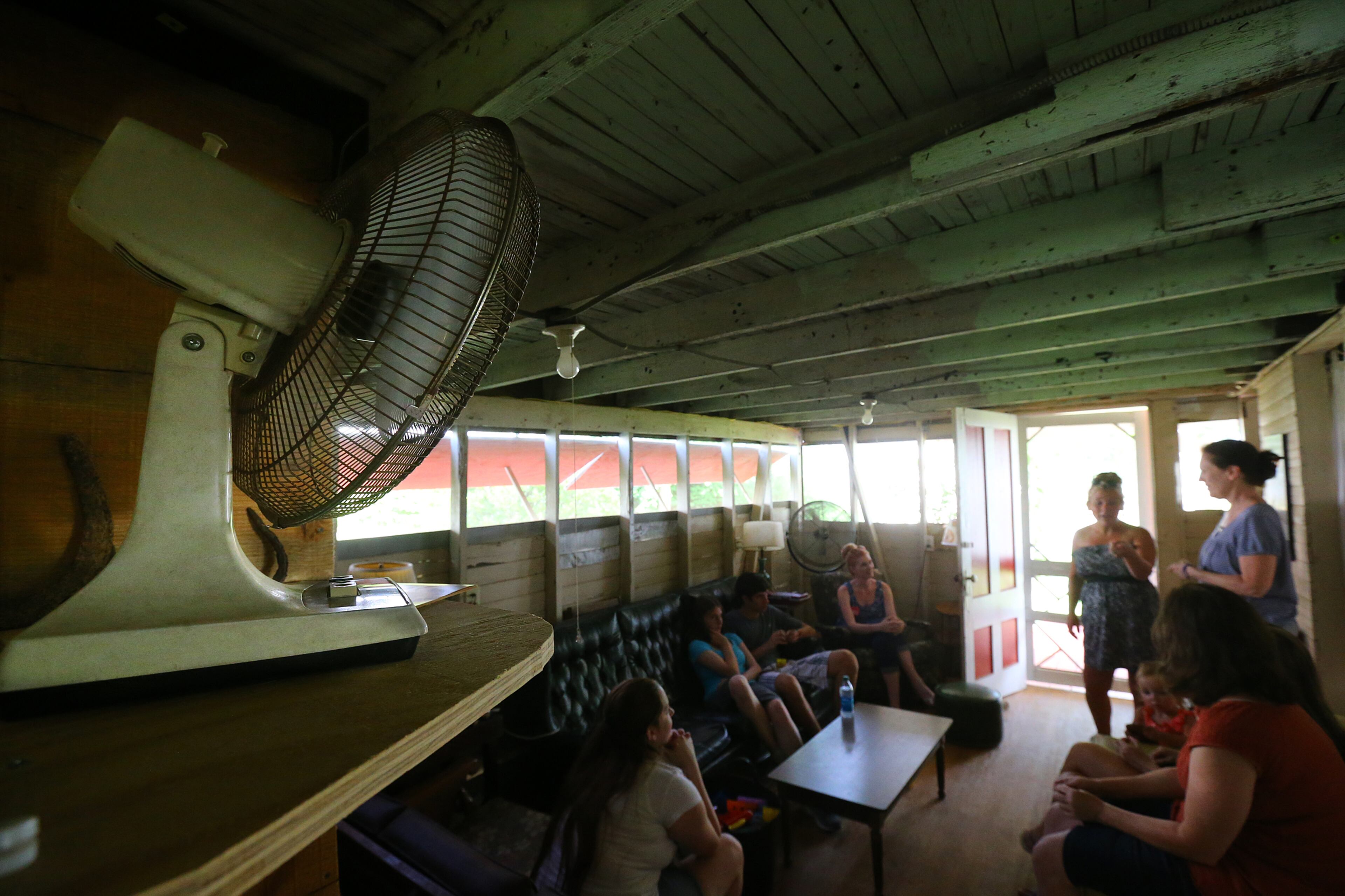 A fan is the only thing to keep family members and visitors cool inside the rustic Moseleys cabin at the Smyrna Presbyterian Church camp meeting on Tuesday, June 24, 2014, in Conyers. Air conditioning units are not allowed to be installed on the historic cabins.