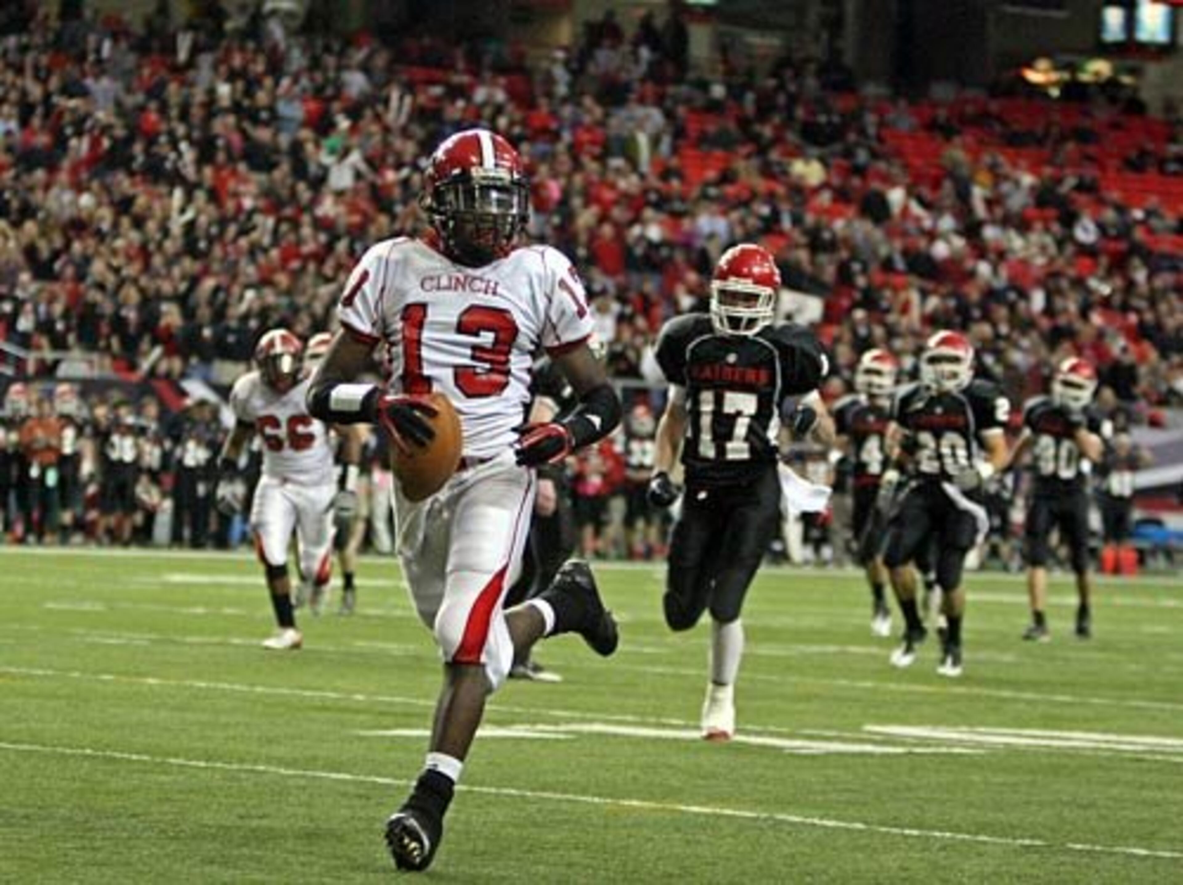 Clinch County's Damian Magby (13) walks into the end zone for a touchdown.