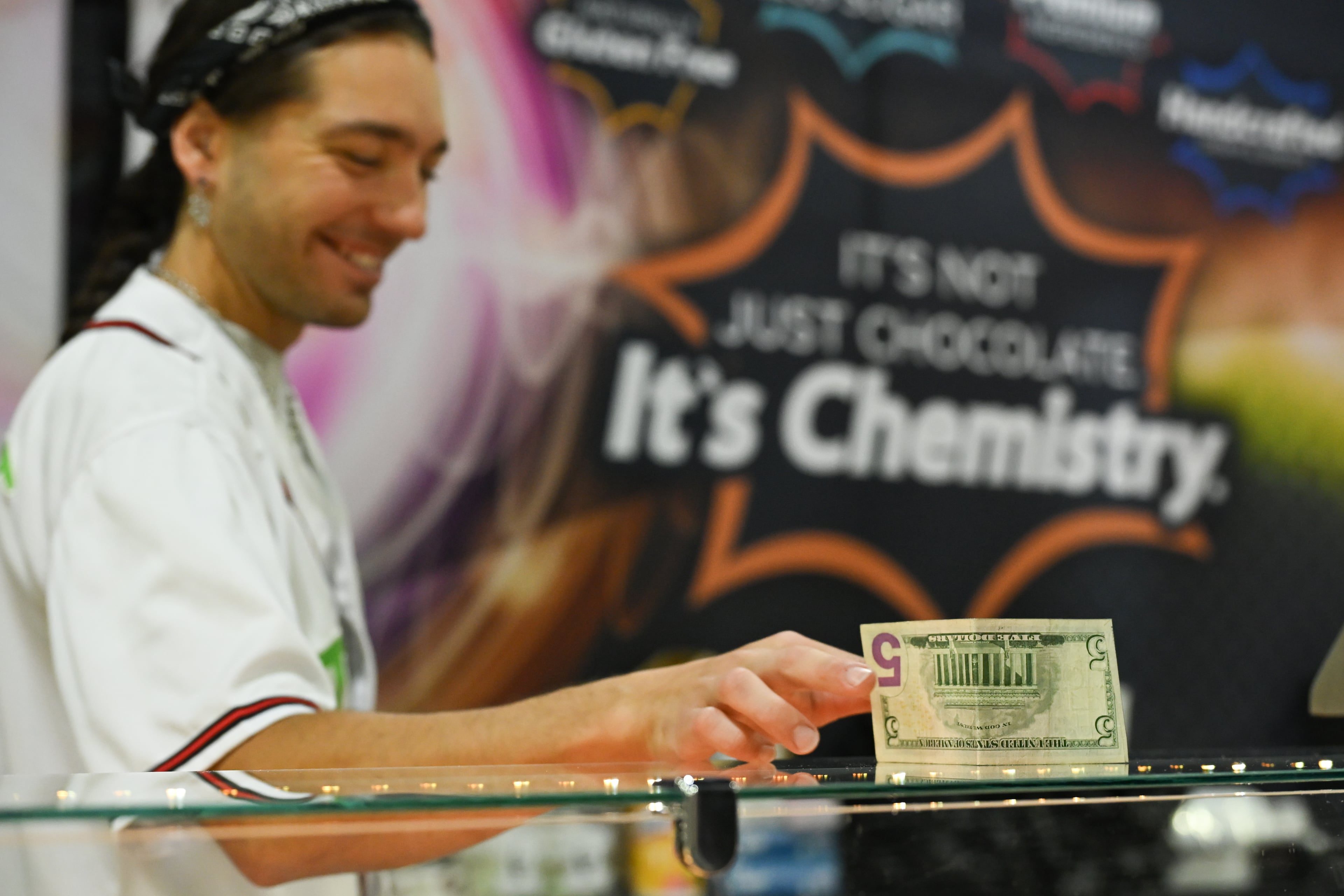 Corey Doeing sells fudge during MomoCon at the Georgia World Congress Center in Atlanta on Friday, May 22, 2026. (Tyler Sun for the AJC)