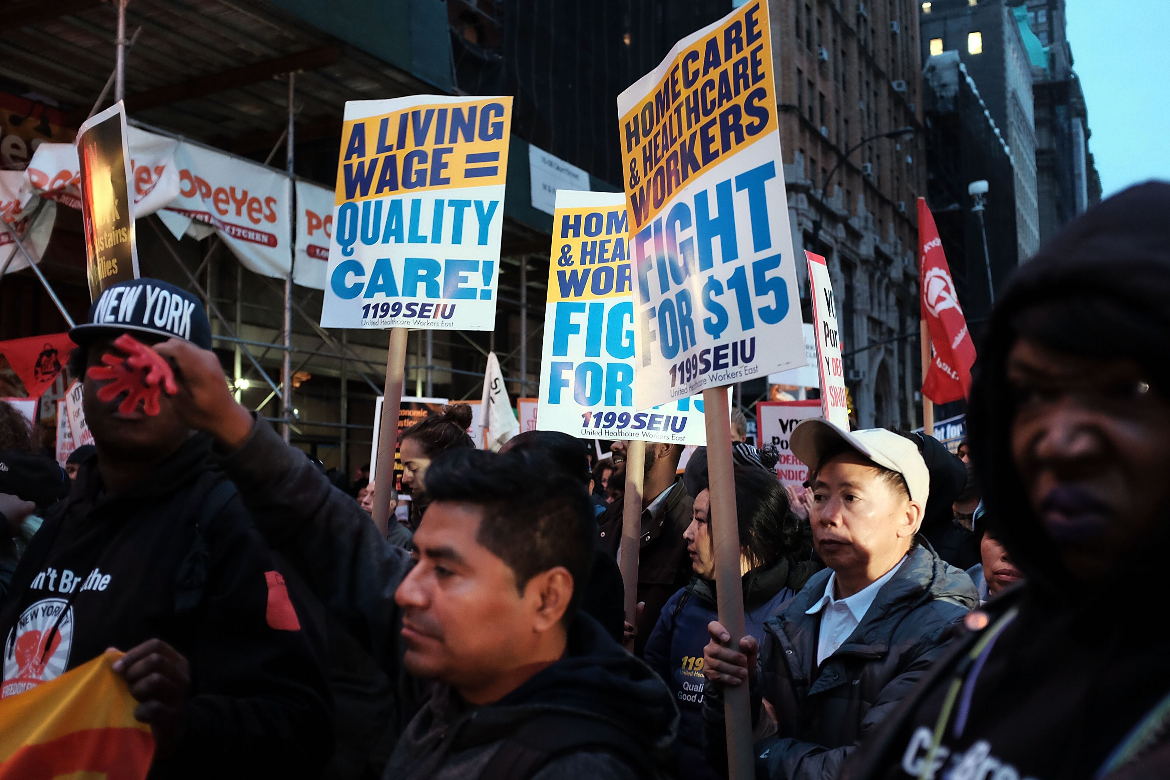 NEW YORK, NY - NOVEMBER 10: Low wage workers and supporters protest for a $15 an hour minimum wage on November 10, 2015 in New York, United States. In what organizers are calling a National Day of Action for $15 and hour minimum wage, thousands of people took to the streets across the country to stage protests in front of businesses that are paying some of their workers the minimum wage. Home care workers, employees in retail and fast food restaurants say that the current minimum is not a living wage. (Photo by Spencer Platt/Getty Images)