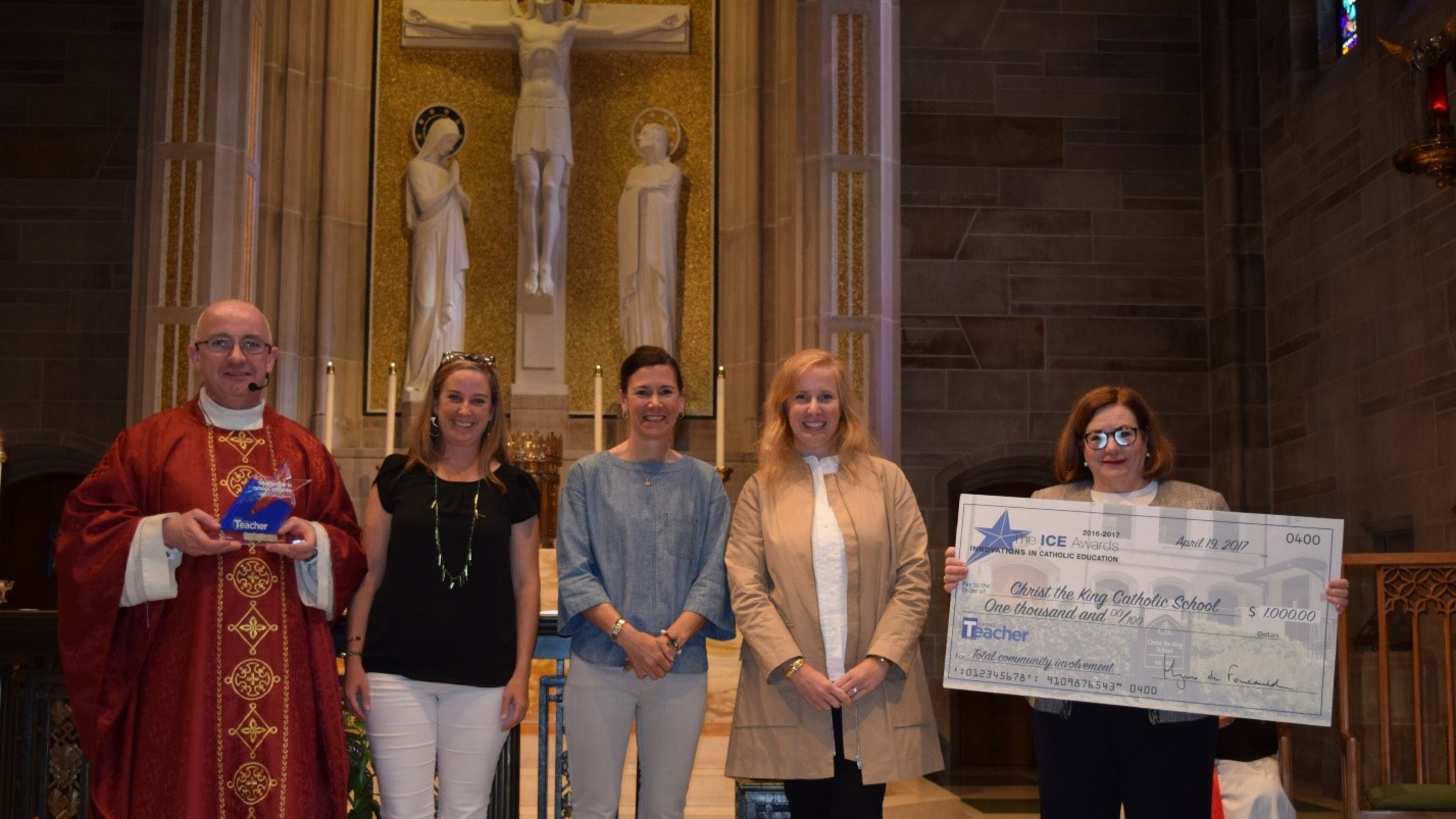 From left: Monsignor Frank McNamee, Kara Land, Lisa Blanco, Robin Minson and Christ the King principal Tricia Ward.