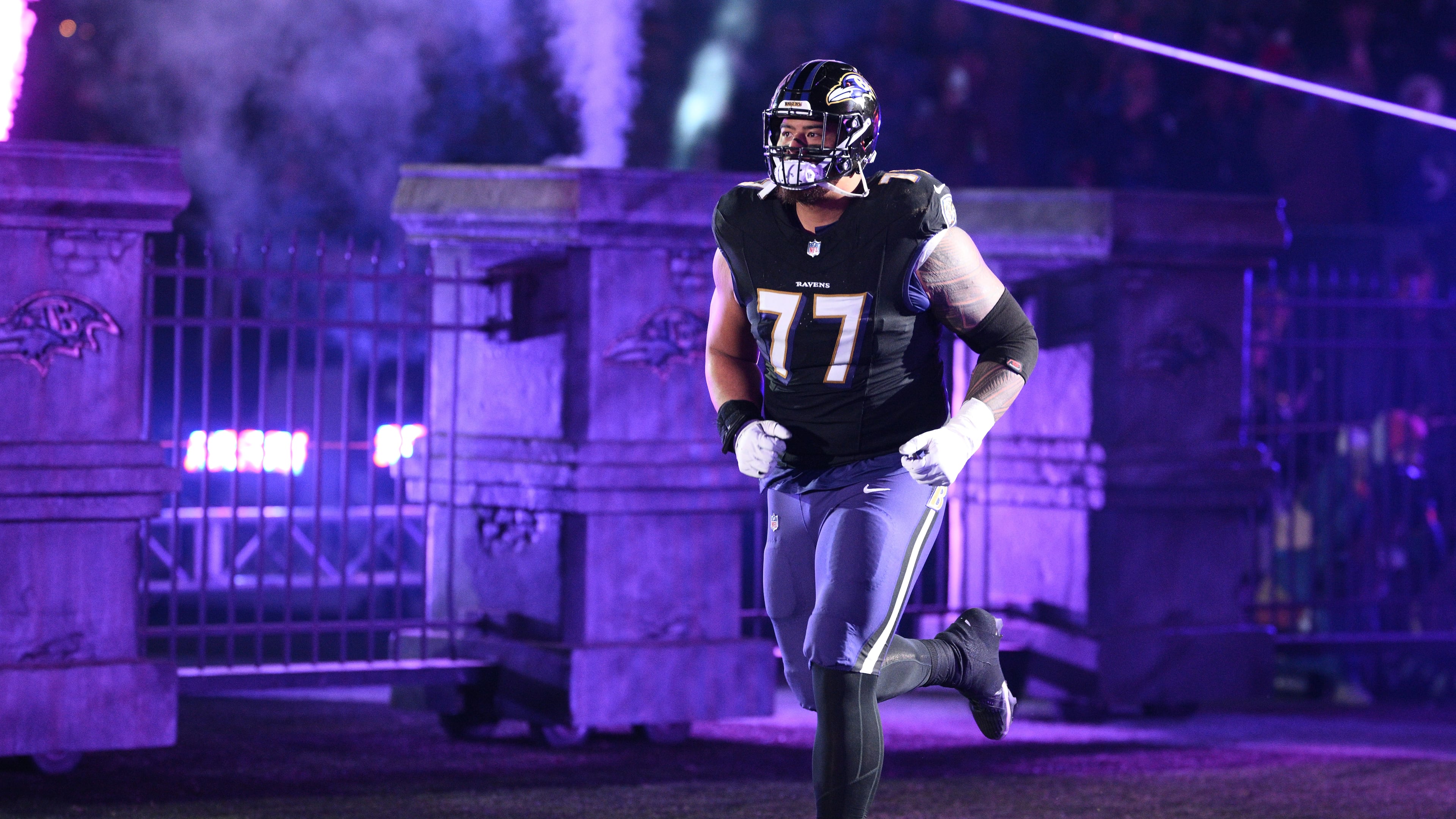 FILE - Baltimore Ravens guard Daniel Faalele (77) takes to the field before an NFL football game against the New England Patriots, Sunday, Dec. 21, 2025, in Baltimore. (AP Photo/Nick Wass, file)