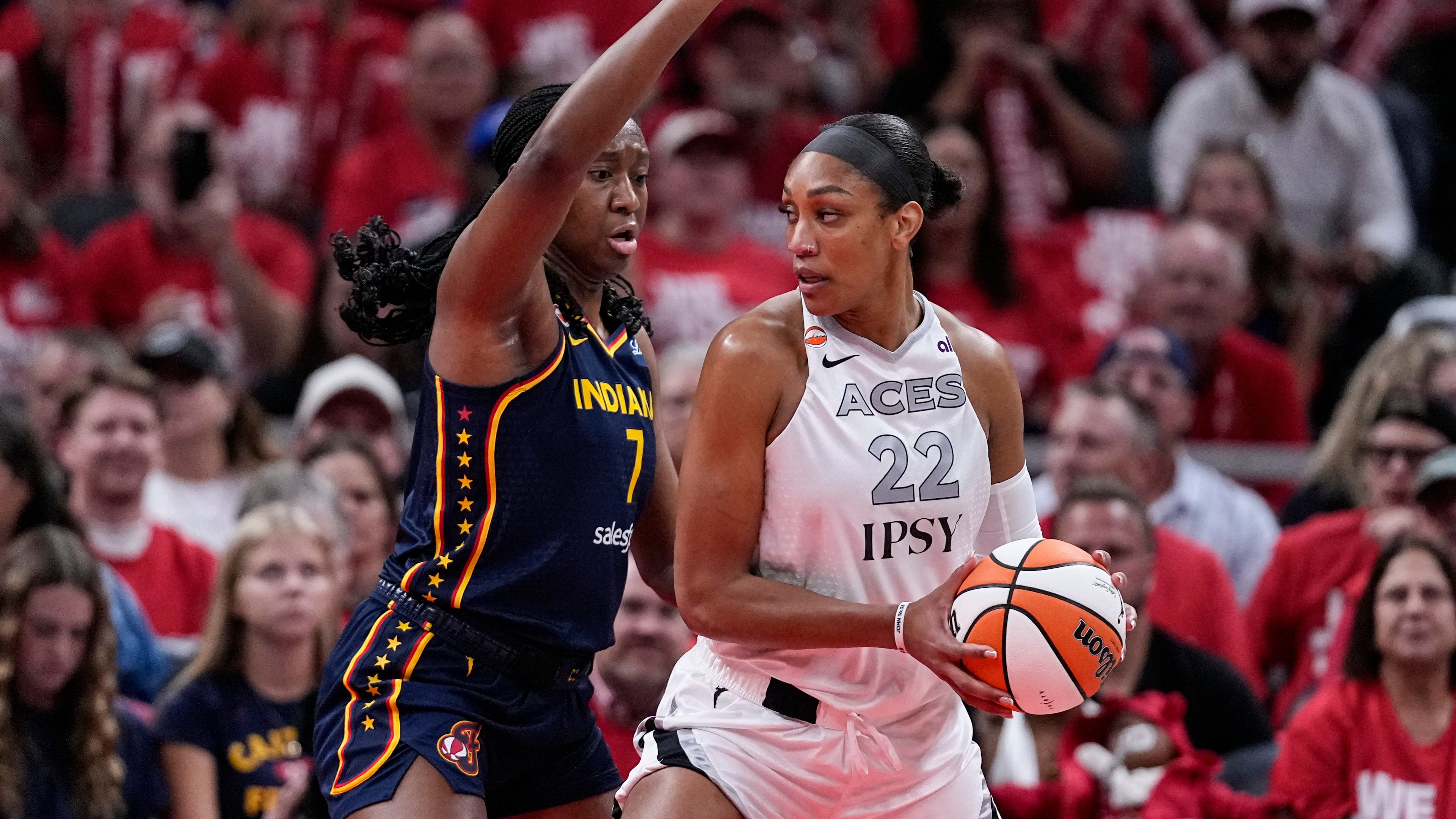 Indiana Fever center Aliyah Boston (7) defends Las Vegas Aces center A'ja Wilson (22) during the first half in Game 2 of a WNBA basketball first-round playoff series in Indianapolis, Tuesday, Sept. 29, 2026. (AP Photo/Michael Conroy)